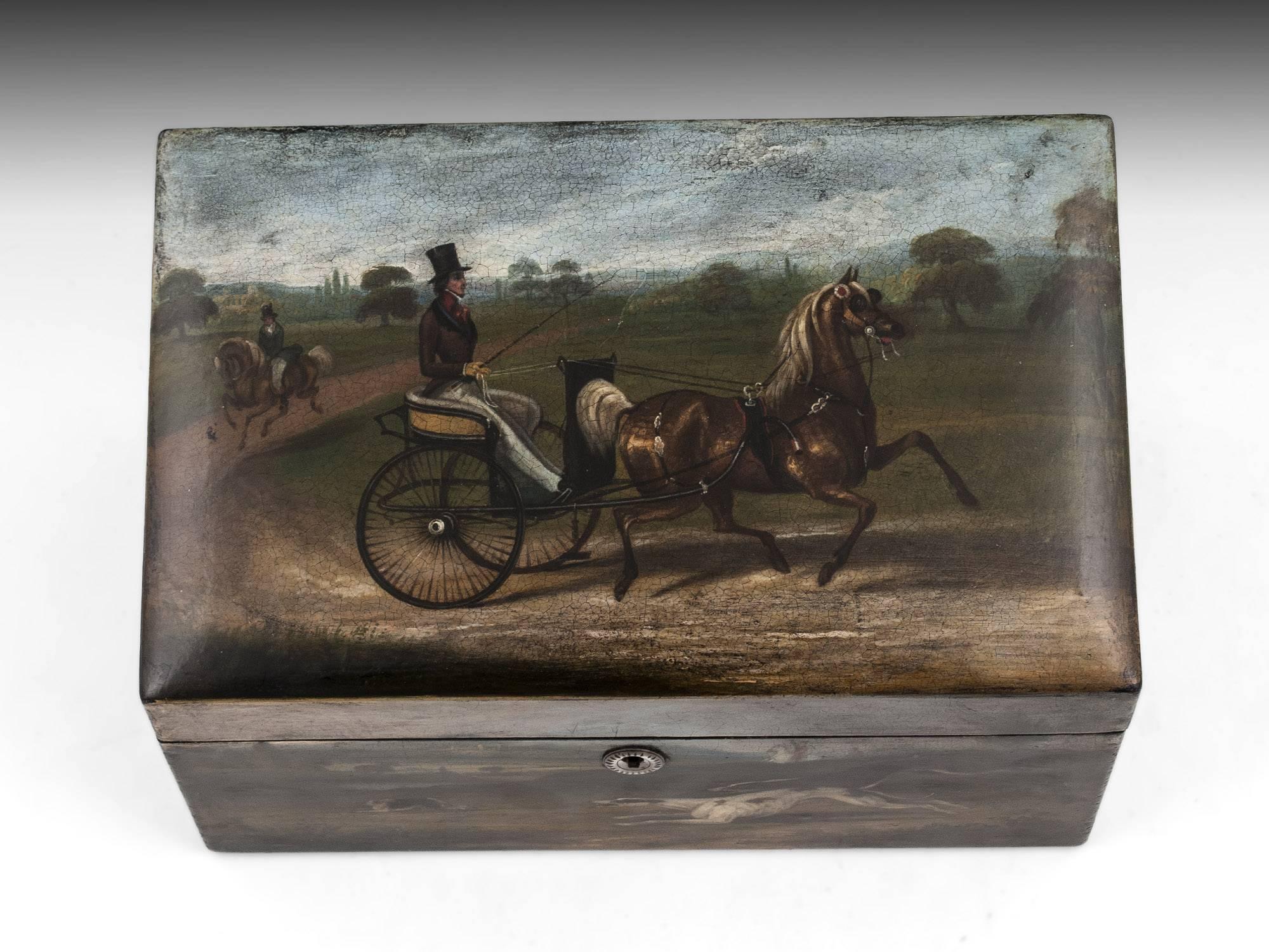 Large papier Mache tea caddy with sloping top, professionally painted all round. The top of papier Mache tea caddy features a beautiful rural themed scene, and the front, a hunting scene. To the centre of the tea caddy is a turned engraved