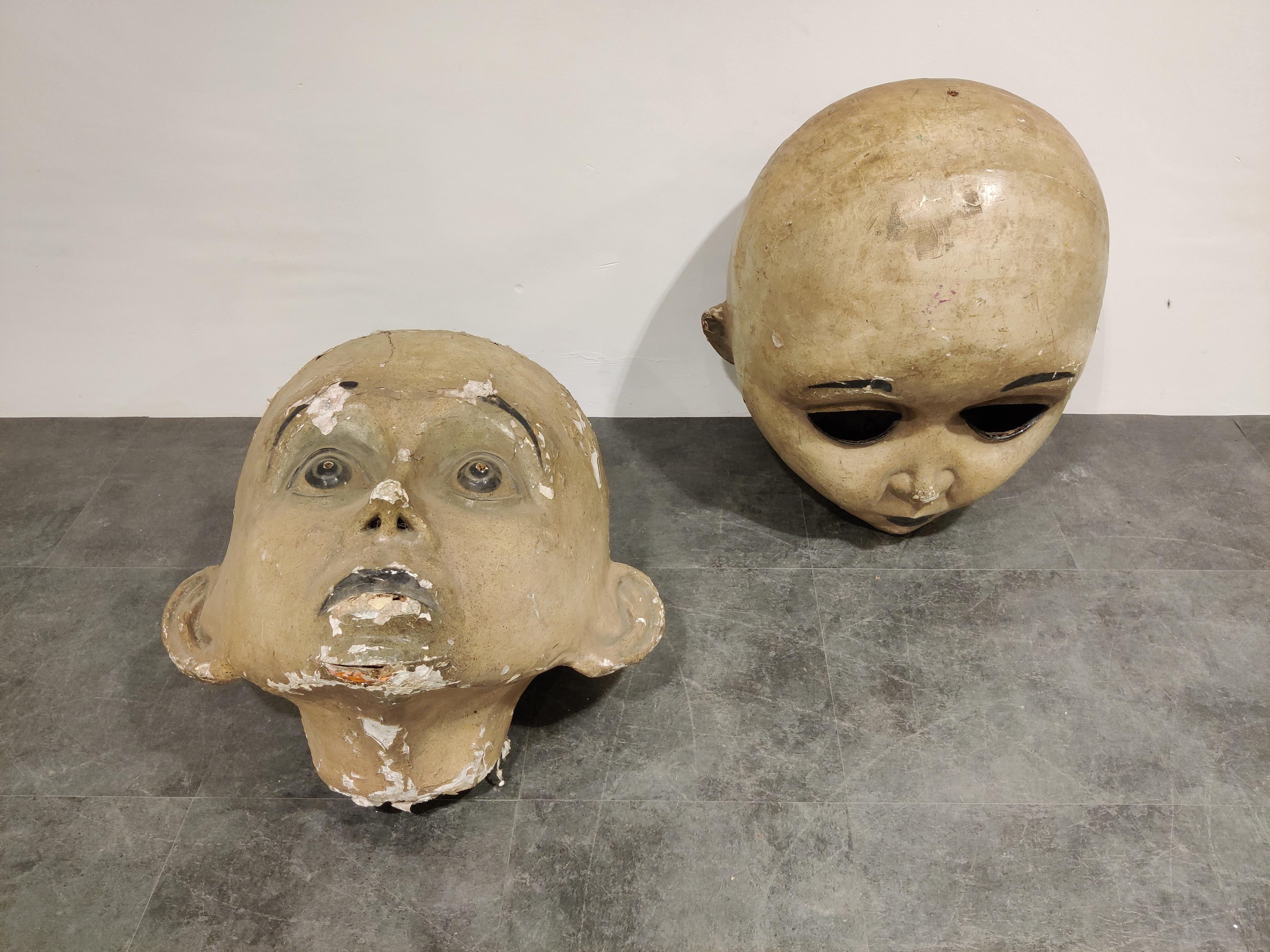 For sale are these rare, large early 20th century carnival masks made from wood and painted papier maché.

Although looking a little creepy and intriguing they have a great decorative potential.

The wear is just right to give them the antique,