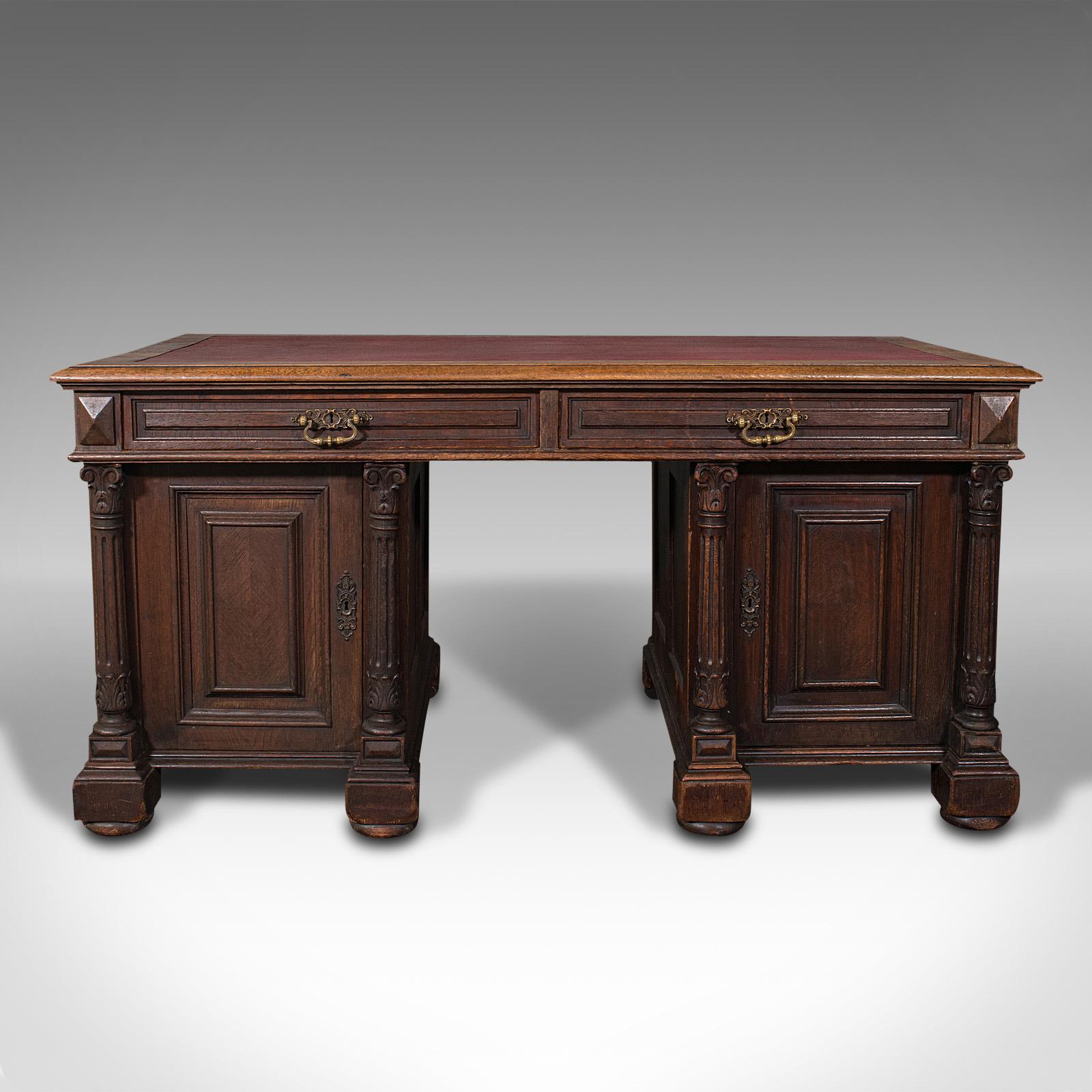 This is a large antique pedestal desk. An English, stout oak writing desk with Gothic revival taste, dating to the Victorian period, circa 1870.

Wonderfully imposing, substantial desk - ideal for the avid writer or home office
Displays a