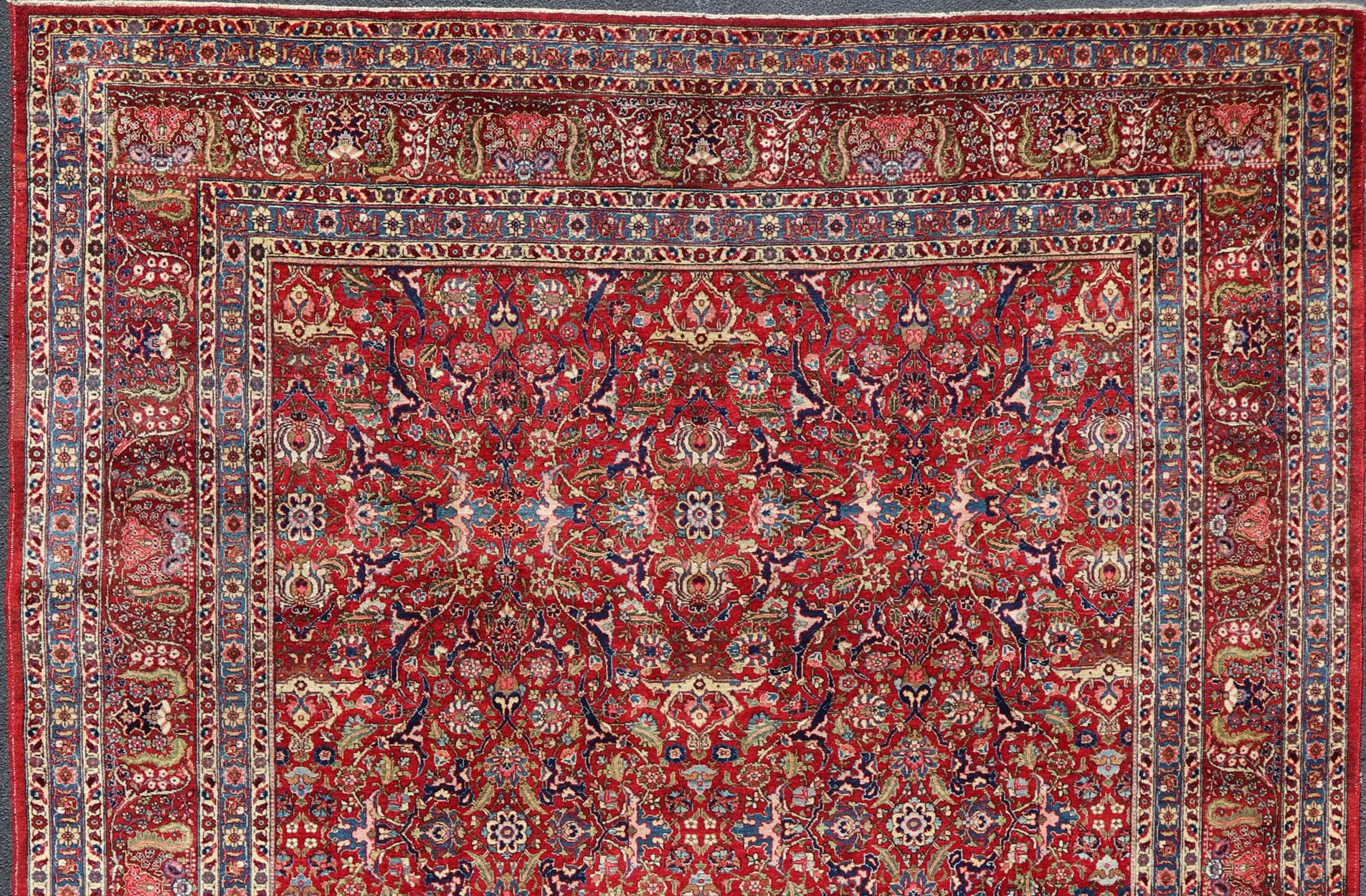 Large Antique Persian Fine Weave Tabriz in Red Background & Light Blue Guard Borders. Finely woven antique Tabriz rug with all-over design field in Red Background & Light Blue Guard Borders and variety of colors in the entire rug Keivan Woven Arts.