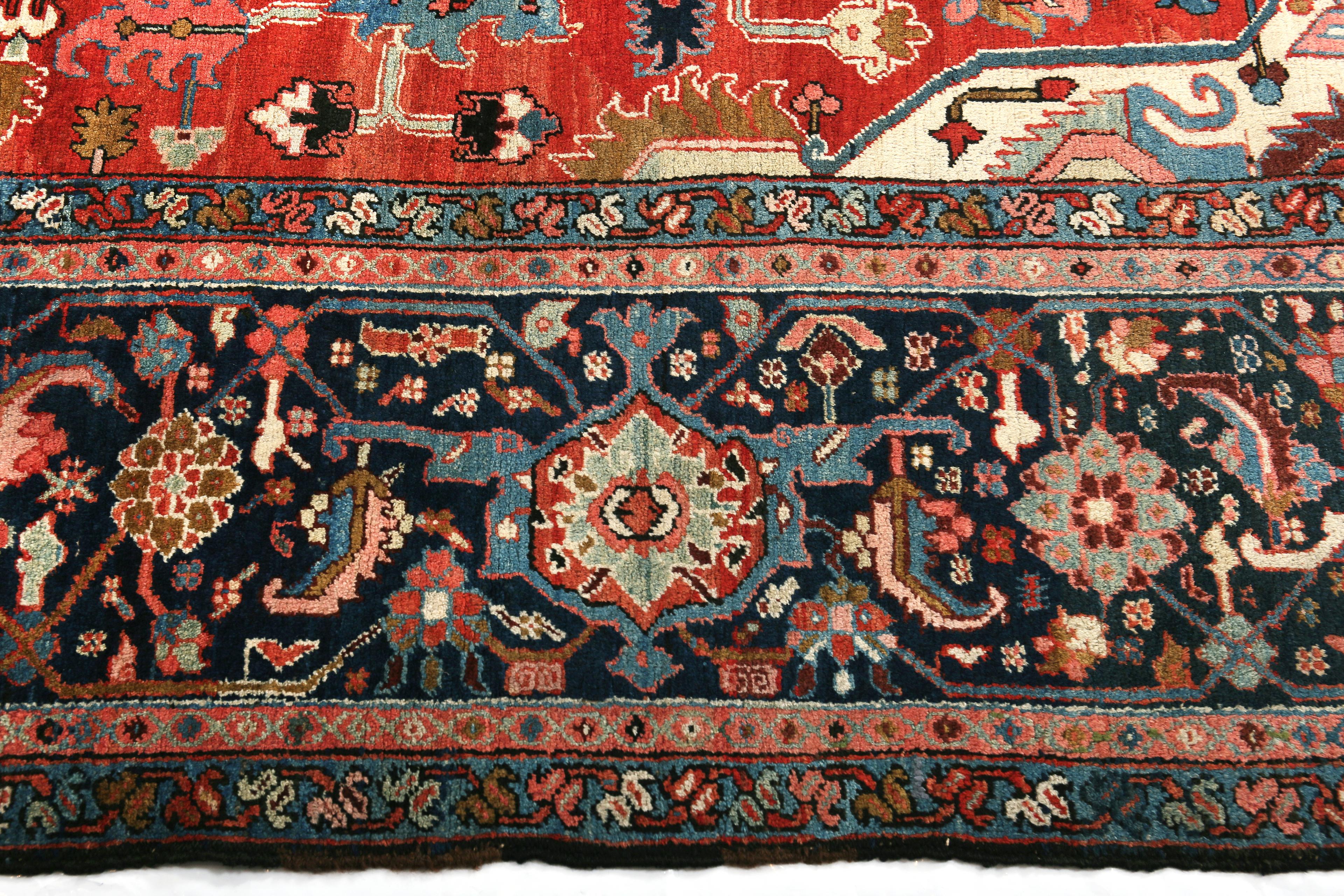 Antique Persian Heriz Serapi Rug (Circa 1900)

This stunning antique Persian Heriz Serapi rug, woven around 1900, spans 12 feet 2 inches by 15 feet 7 inches, embodying the grandeur and bold geometric design for which Heriz Serapi rugs are renowned.
