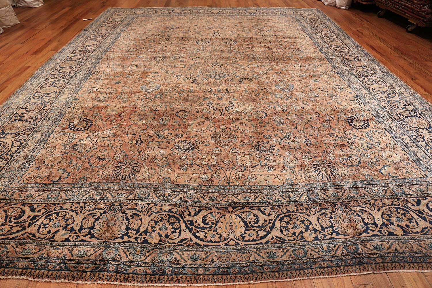 Antique floral Persian Kerman rug, country of origin: Persia, date circa early 20th century. Size: 11 ft 10 in x 15 ft 6 in (3.61 m x 4.72 m). The city and province of Kerman in south central Iran has been at the heart of the rug trade for hundreds