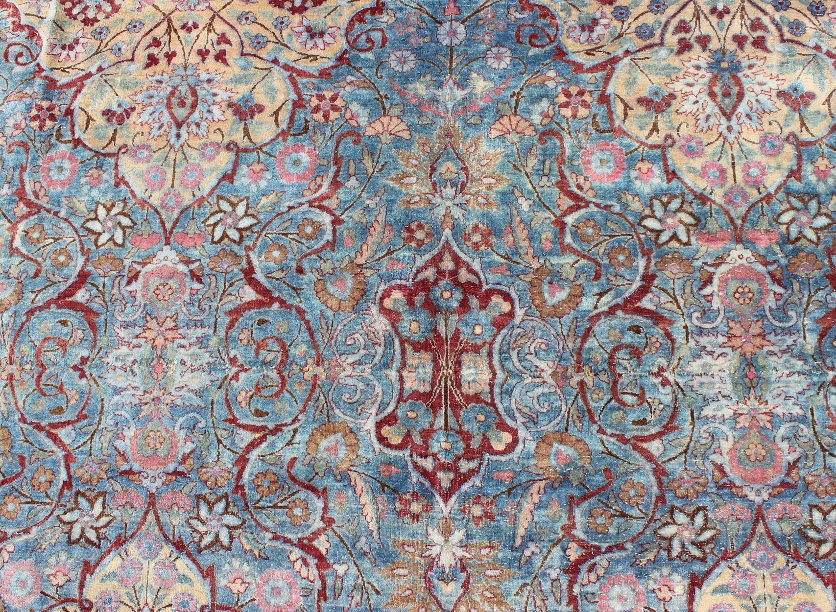 Kirman Large Antique Persian Kerman Rug with Medallions in Light Blue, Red and Pink For Sale
