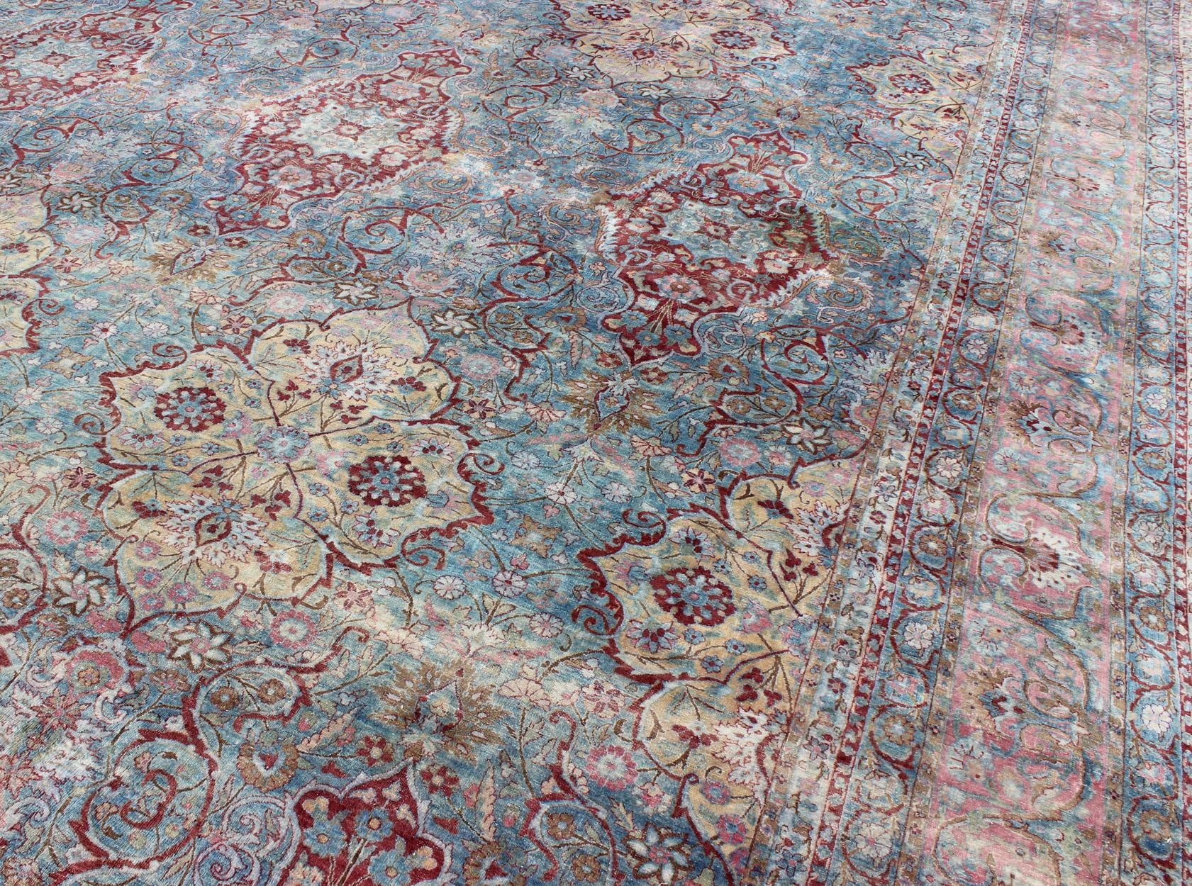 Early 20th Century Large Antique Persian Kerman Rug with Medallions in Light Blue, Red and Pink For Sale