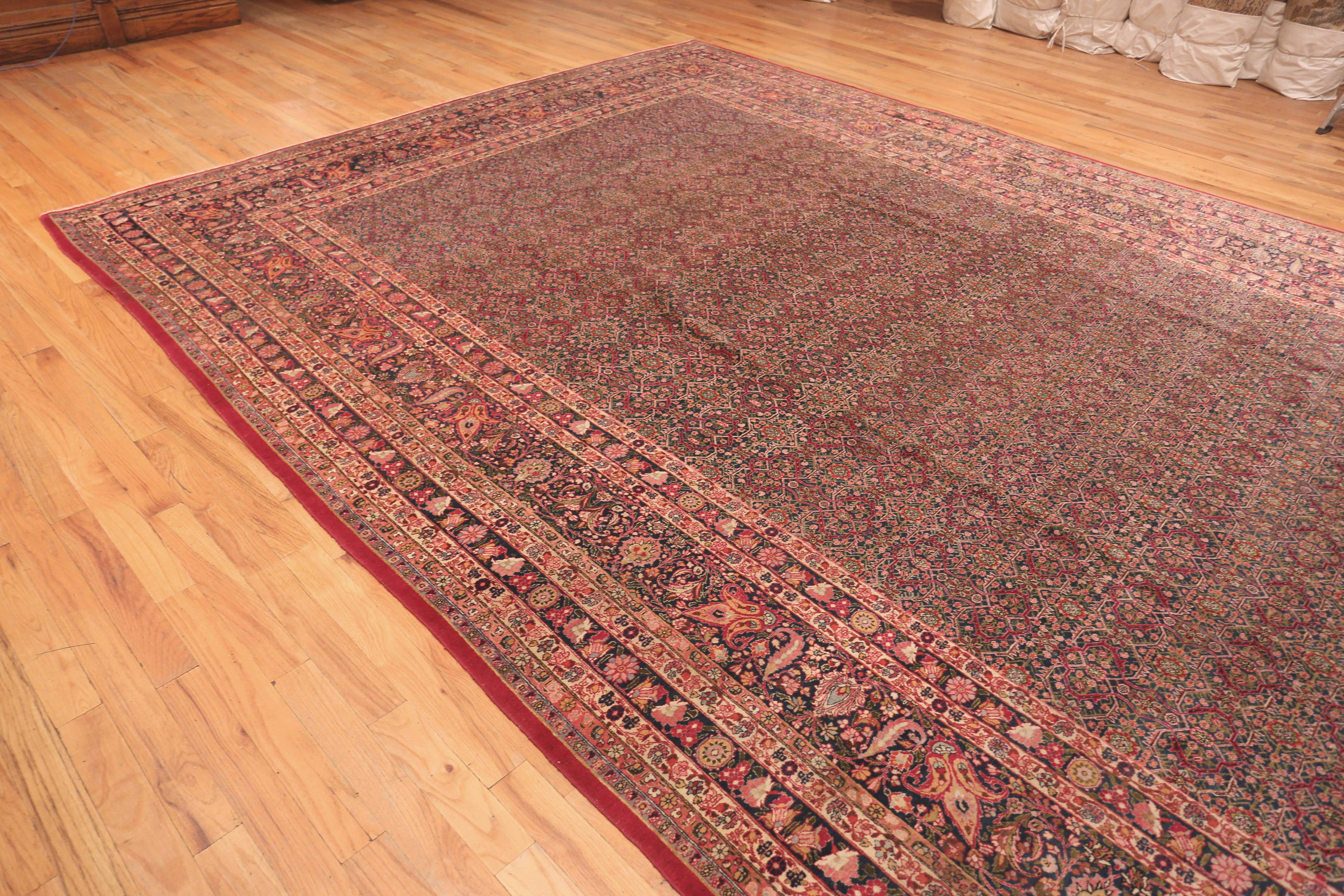 Large Antique Persian Khorassan Rug, Country of origin, Persia, Circa date: 1920. Size: 11 ft 5 in x 16 ft 7 in (3.48 m x 5.05 m)
 