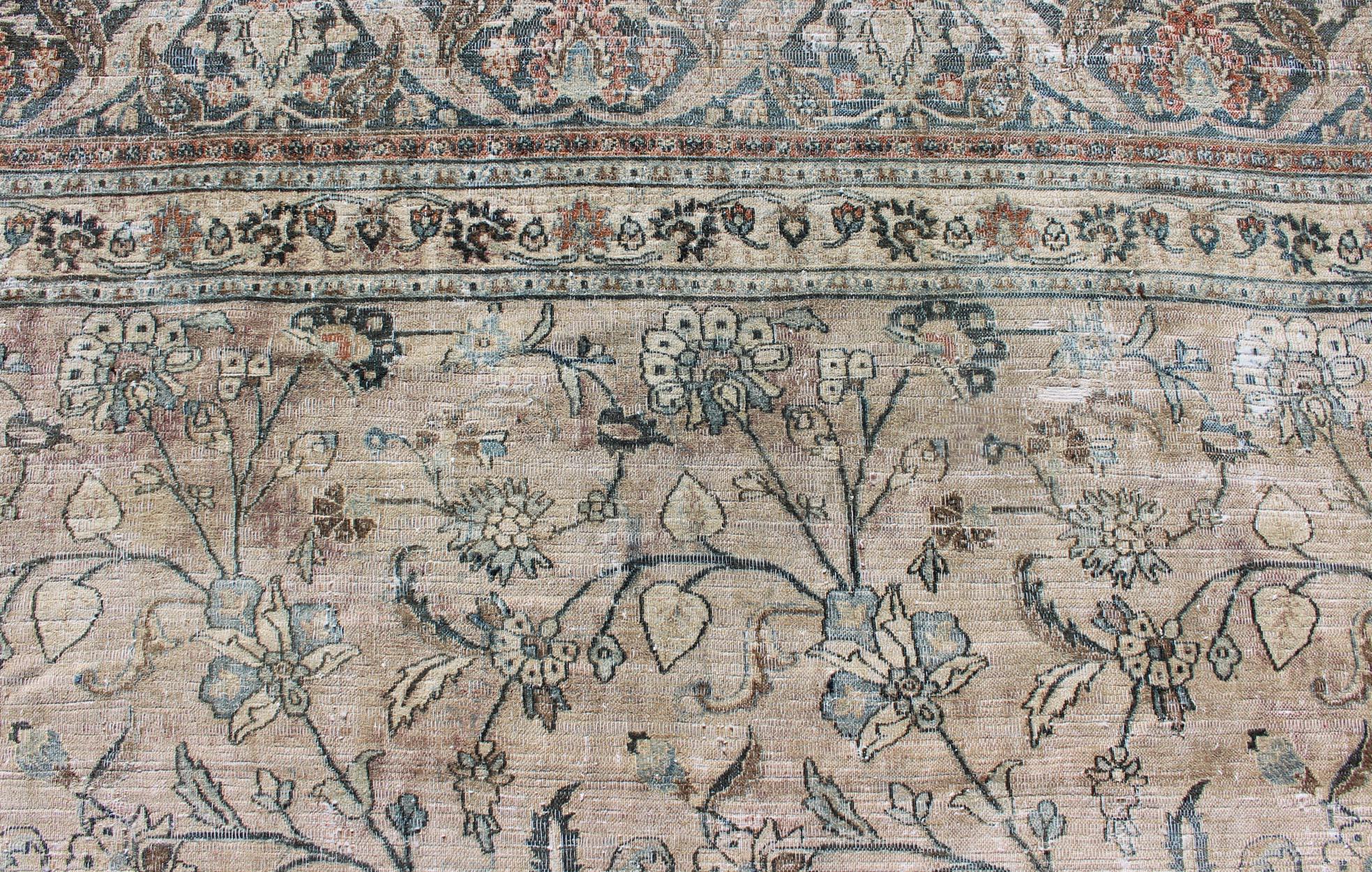 Large Antique Persian Khorassan with All-Over Earth Tones Botanical Design In Distressed Condition For Sale In Atlanta, GA