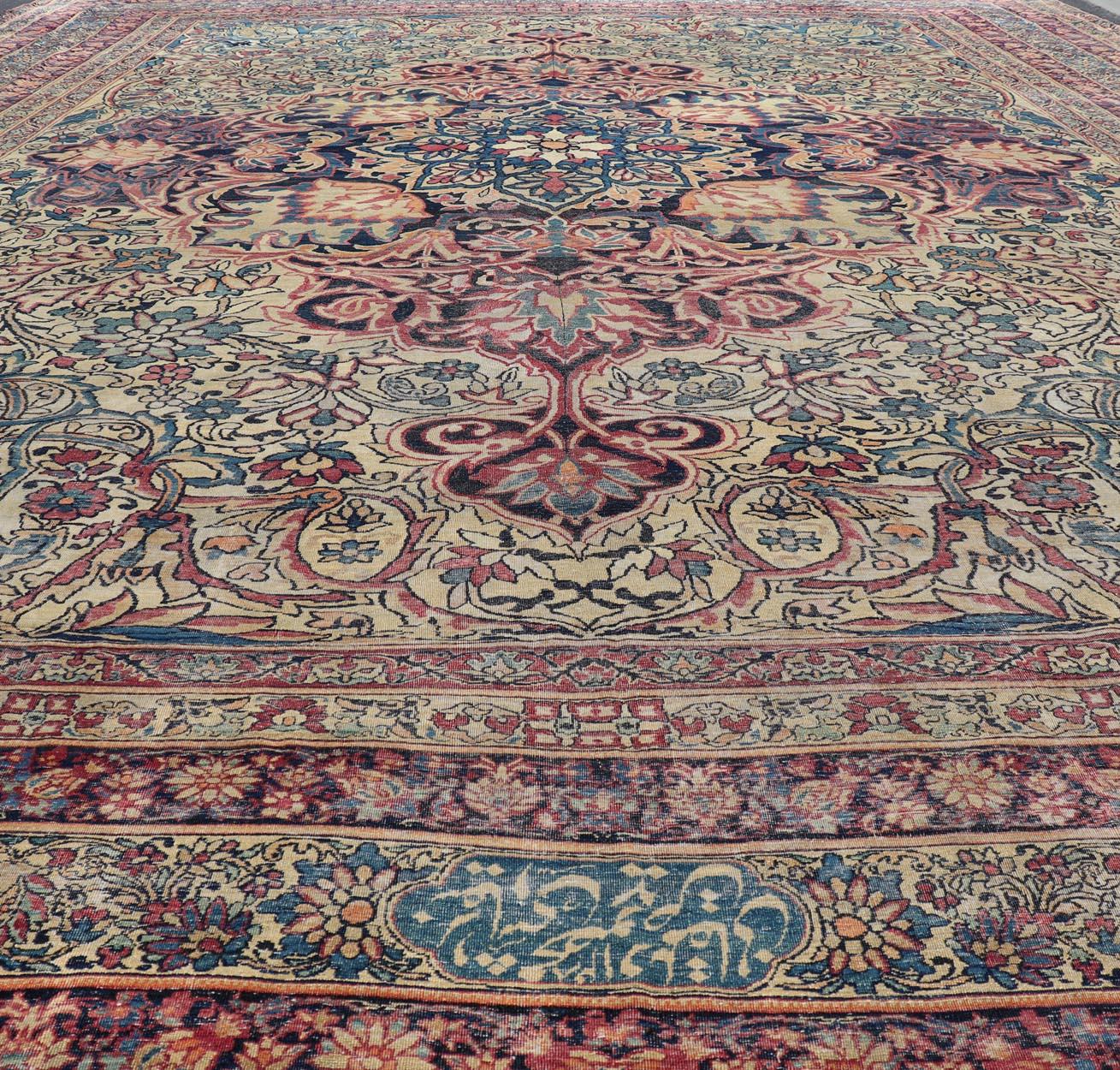 Hand-Knotted Large Antique Persian Lavar Kerman Rug with Blooming Central Medallion For Sale