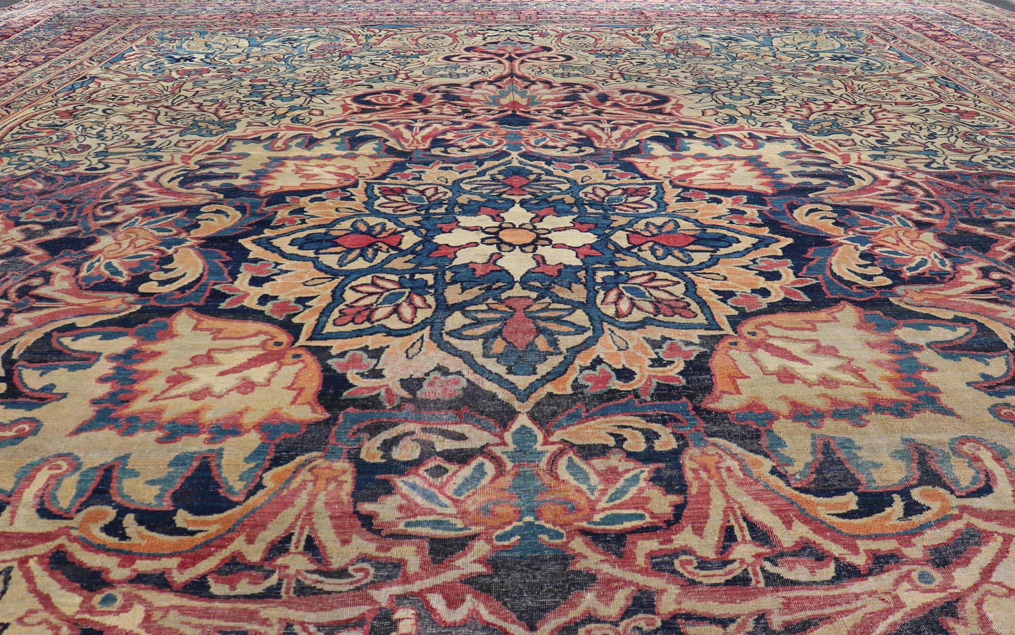 Large Antique Persian Lavar Kerman Rug with Blooming Central Medallion In Good Condition For Sale In Atlanta, GA