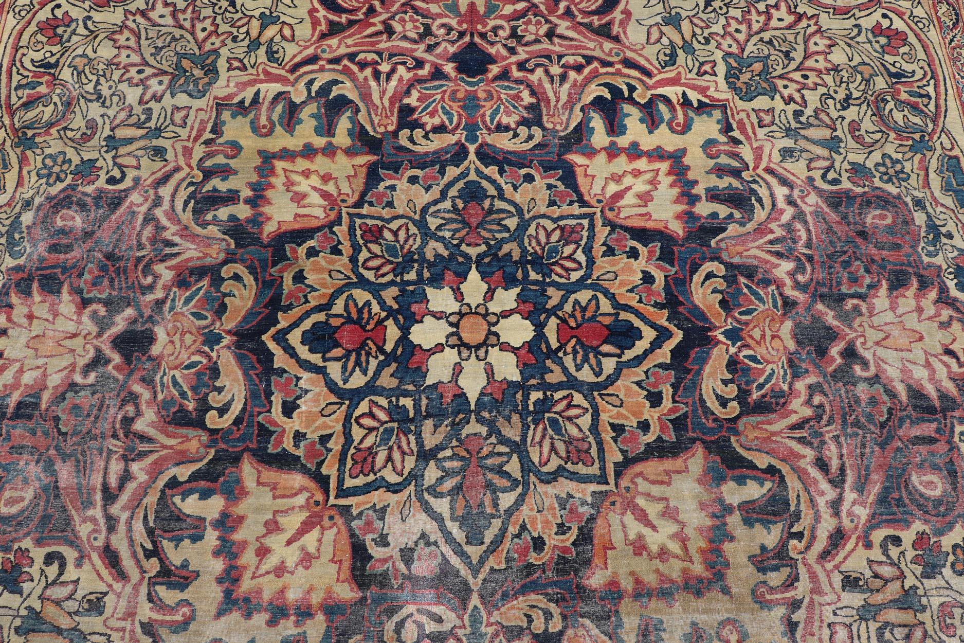 20th Century Large Antique Persian Lavar Kerman Rug with Blooming Central Medallion For Sale