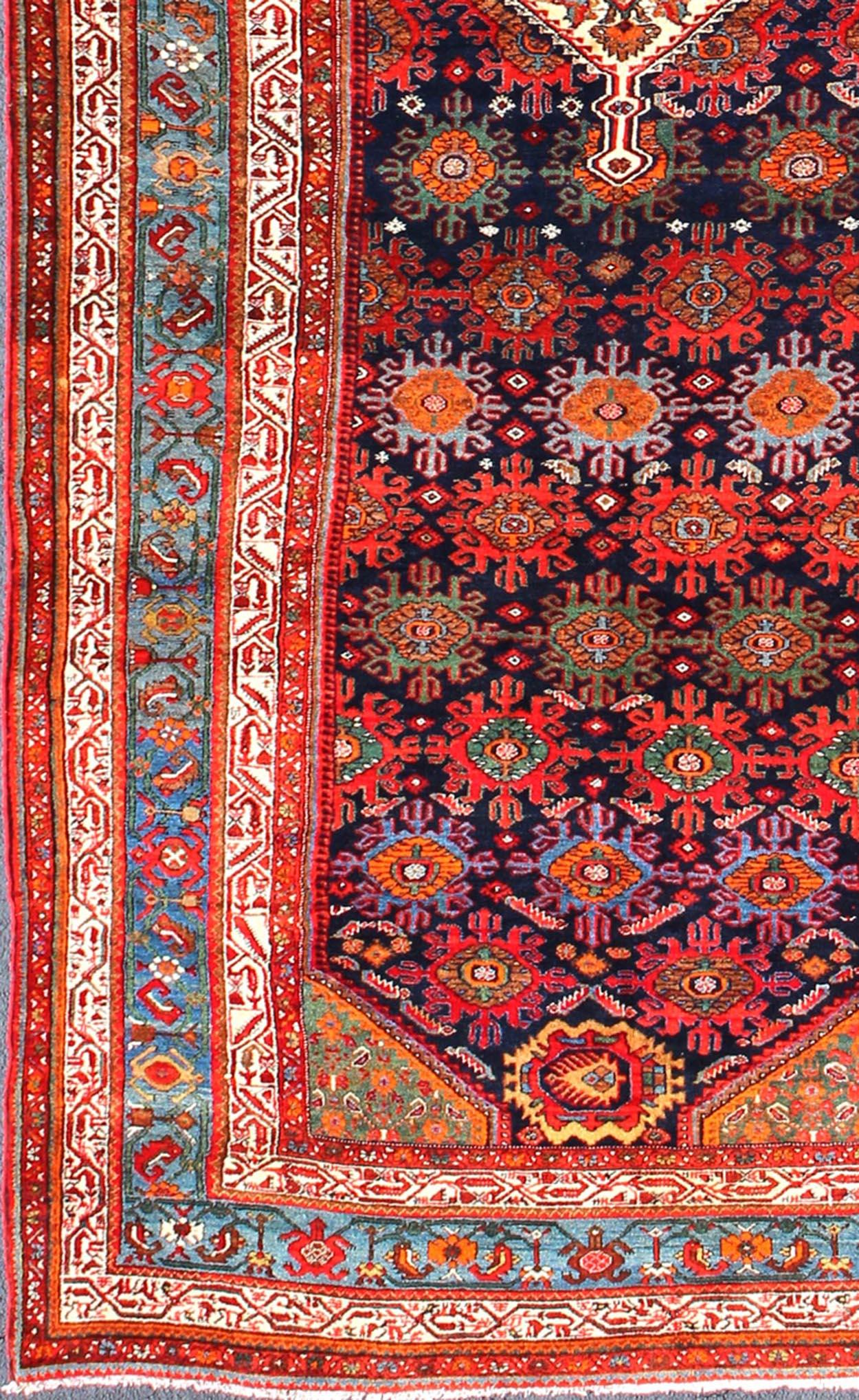 Multicolored antique Persian Malayer long and wide gallery runner with geometric medallion and motifs, rug ema-7582, country of origin / type: Iran / Malayer, circa 1910.

This lovely antique Persian Malayer runner originates from the northwest