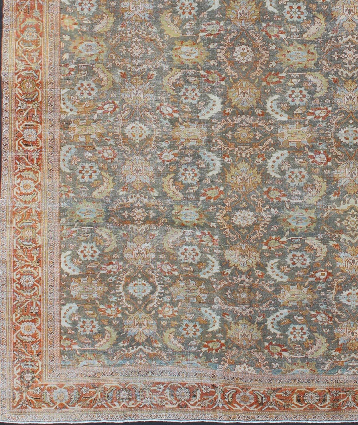 Large antique Persian Sultanabad rug in gray/green, lime green, light blue, yellow, cream, faded gold, salmon, light green and rust/red, rug 18-0301, country of origin / type: Iran / Mahal, circa 1900

Measures: 13'3 x 19'8.

This antique Persian