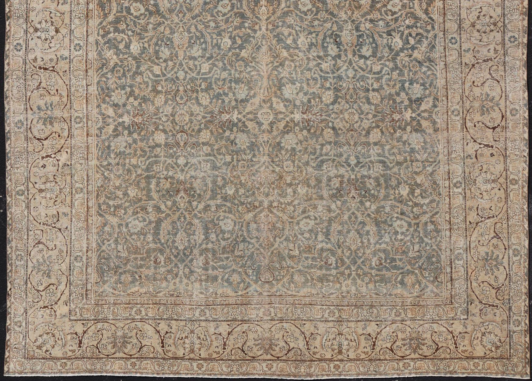 Muted Blue-Gray Background Persian Tabriz rug with Floral and geometric motifs, Keivan Woven Arts/ rug VAS-2, country of origin / type: Iran / Tabriz, circa 1910. Large Antique Persian Tabriz Rug in Wool with All-Over Floral Design.

Measures: