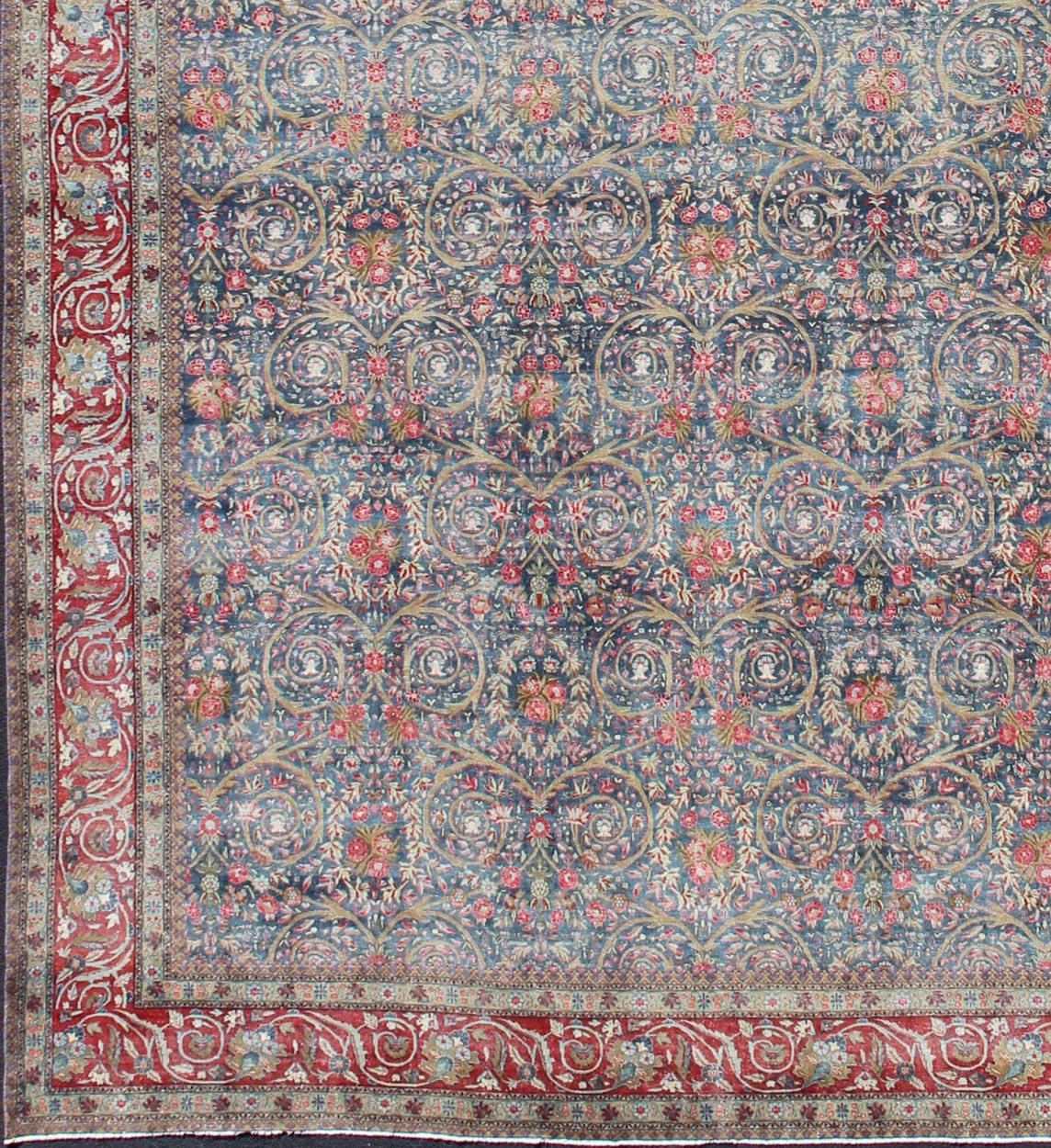 Blue background, Red border and multi colors such as light green, taupe, light blue/gray antique Persian Tabriz Large rug with flowers and all-over vine scroll , rug 18-0403, country of origin / type: Iran / Tabriz, circa 1890.
Measures: 14'6 x