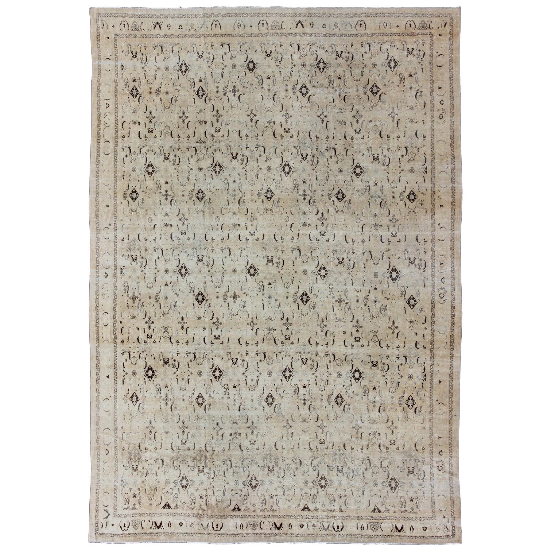 Large Antique Persian Tabriz Rug with All over Design in Cream and Brown Accents For Sale