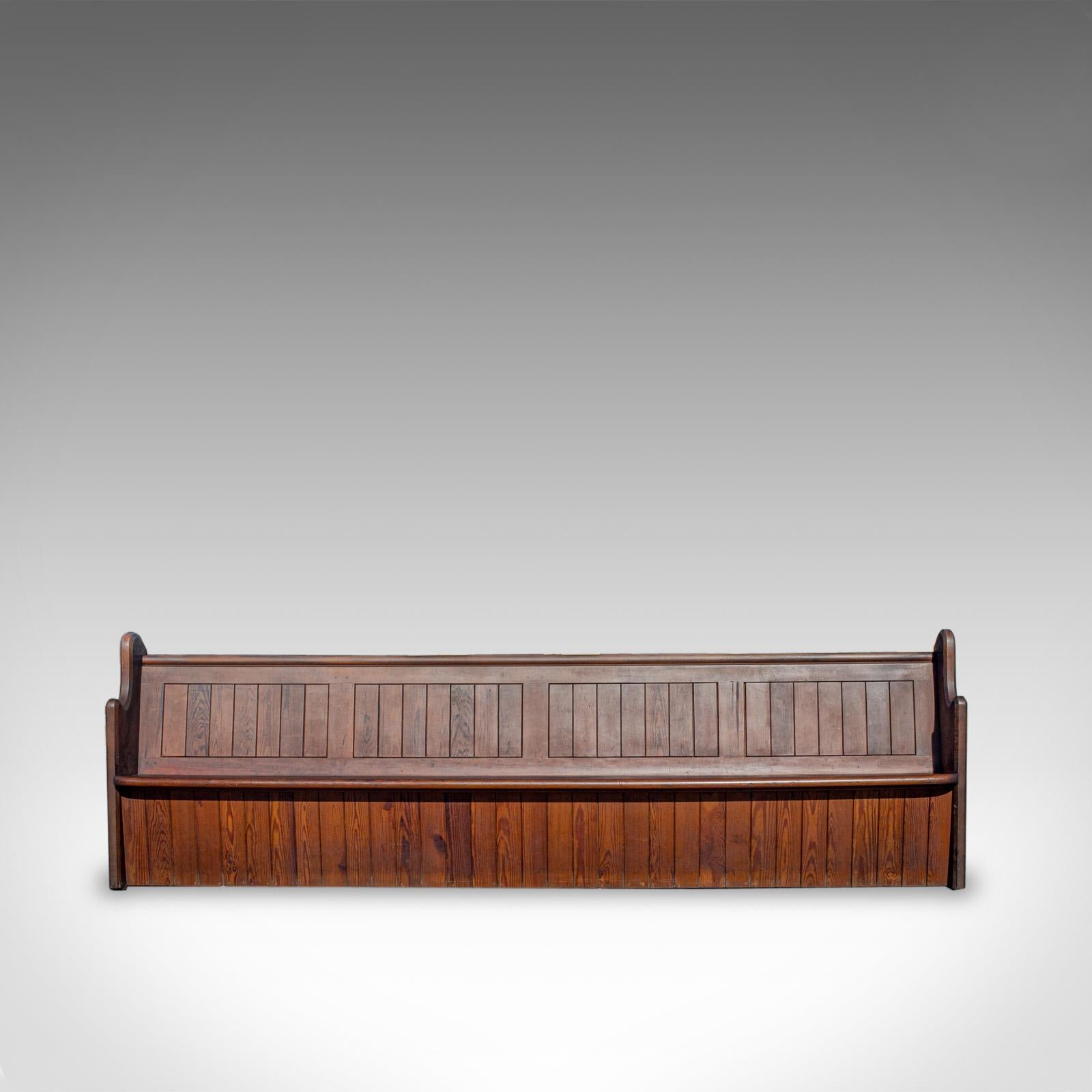 This is a large (10') antique pew. An English, pitch pine bench seat for 7-8 people and dating to the late 19th century, circa 1880.

Impressive proportion at 10ft wide, seating 7-8 people
Displays fine grain interest and a desirable aged