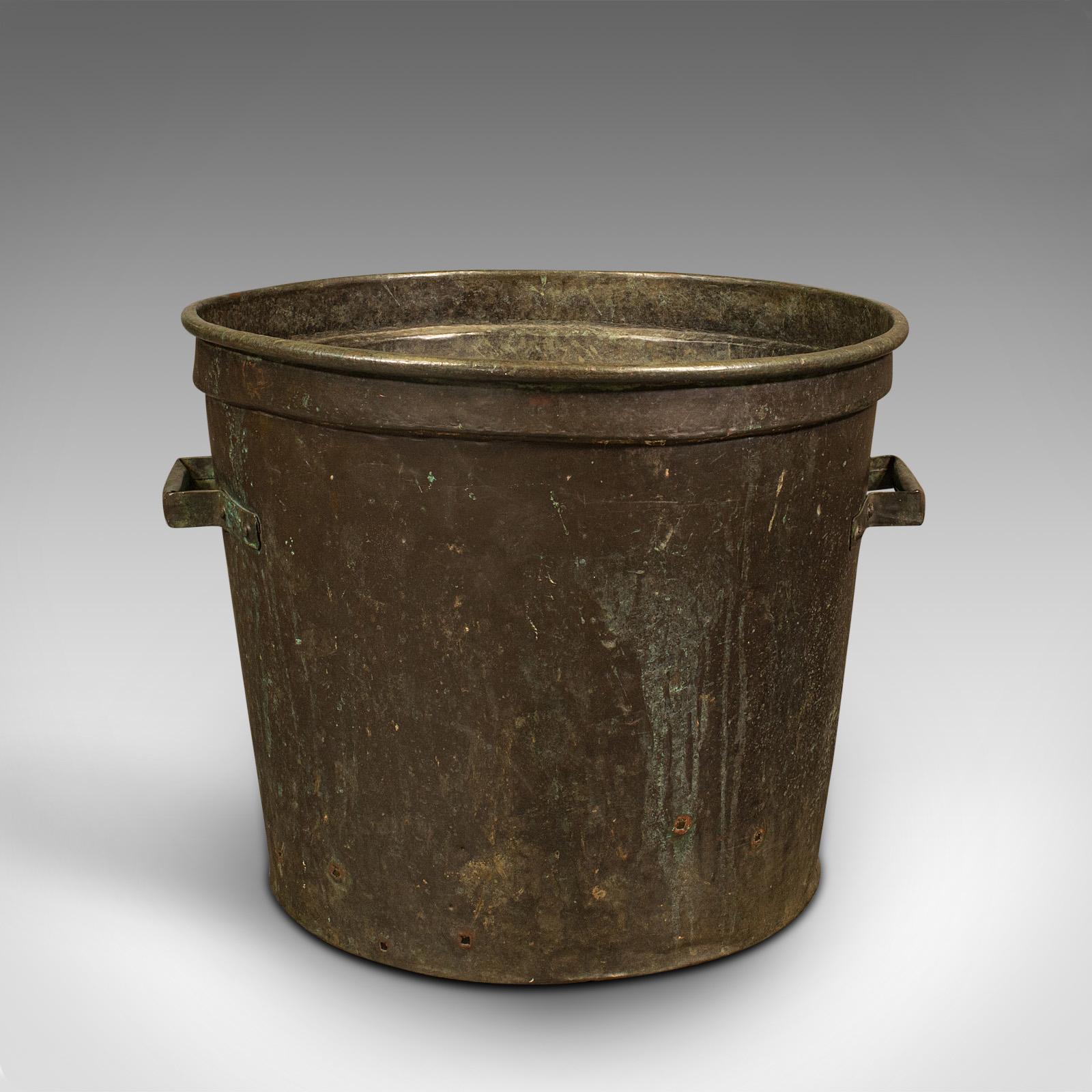 This is a large antique planter. An English, copper log bucket or jardiniere pot, dating to the early Victorian period, circa 1850.

Generous size and superb patination
Displays a desirable aged patina and in good order
Weathered copper a treat of
