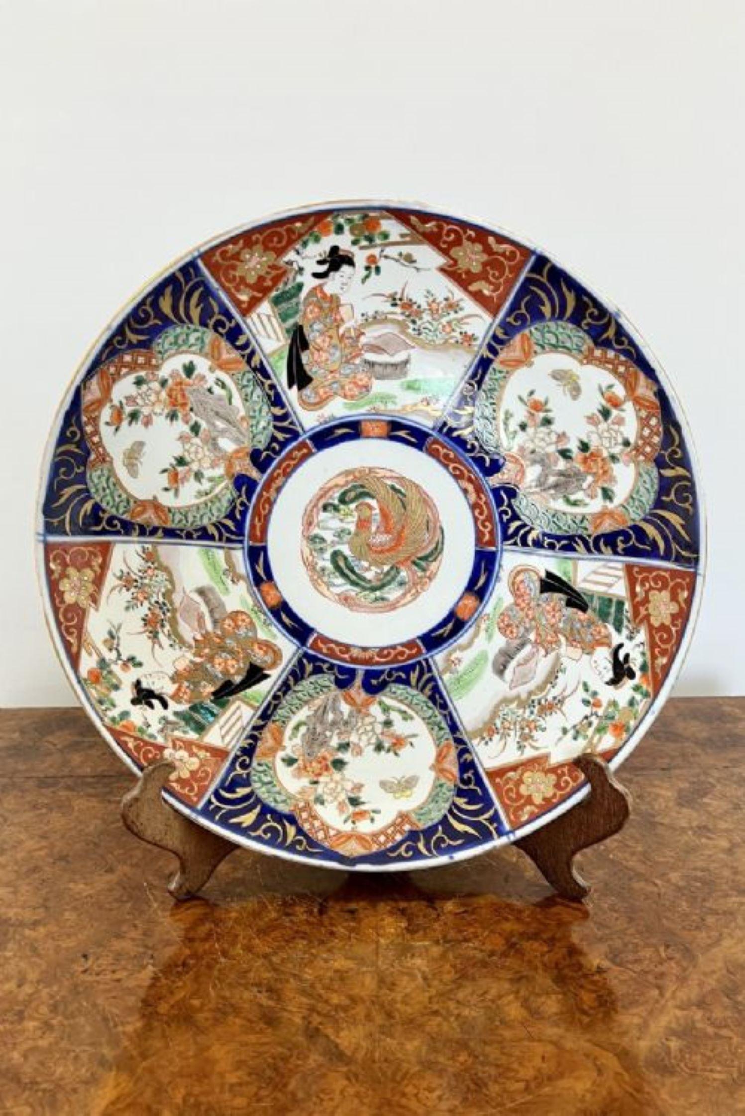 Large antique quality Japanese imari charger having fantastic quality hand painted panels with Japanese ladies in traditional clothing, flowers, leaves, trees and birds in wonderful blue, red, white, green and gold colours 