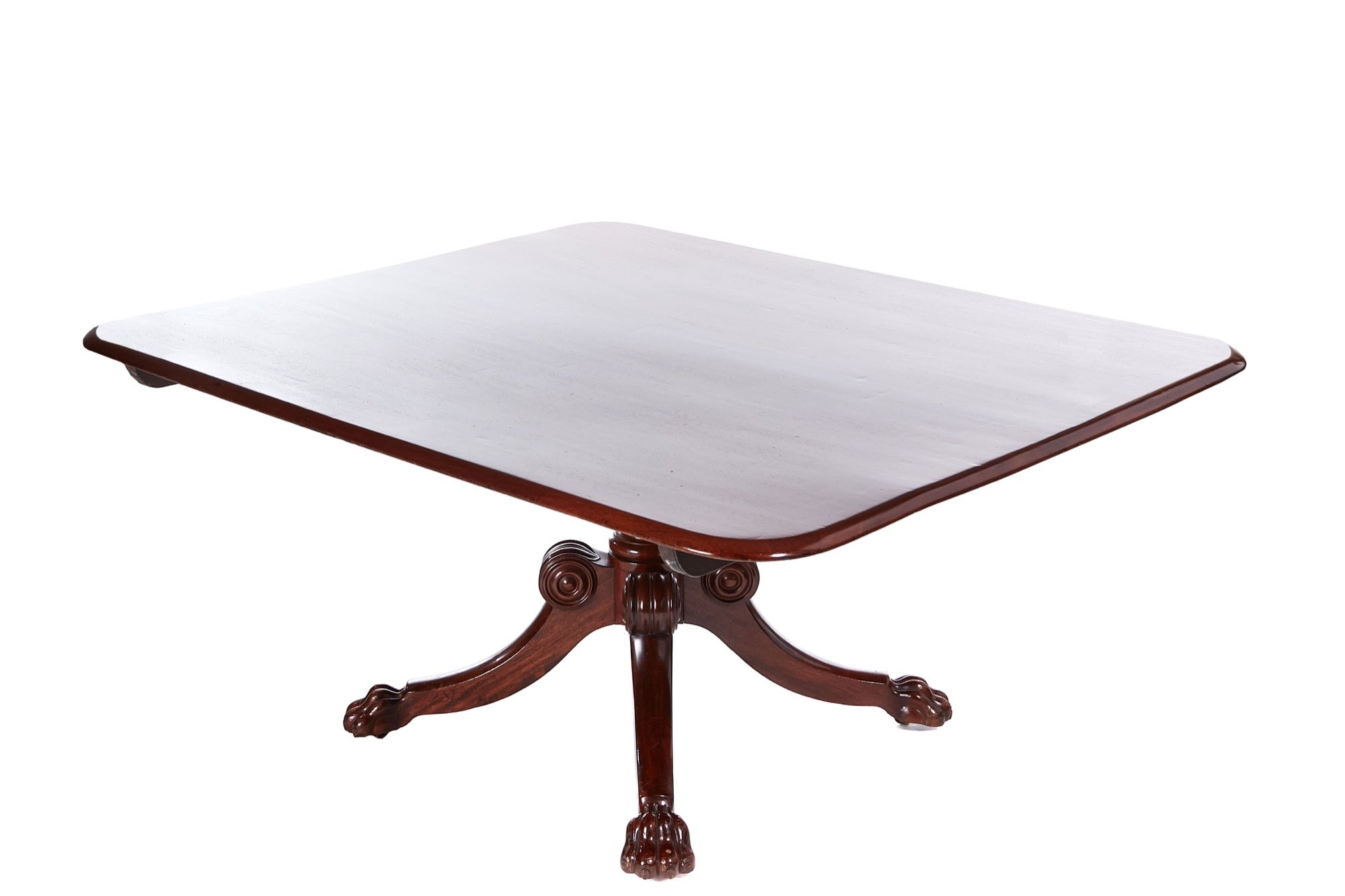 Large antique Regency quality mahogany centre table having a quality figured mahogany tilt top with a moulded edge supported on a turned pedestal column standing on four shaped sabre legs with carved paw feet and original castors

A handsome