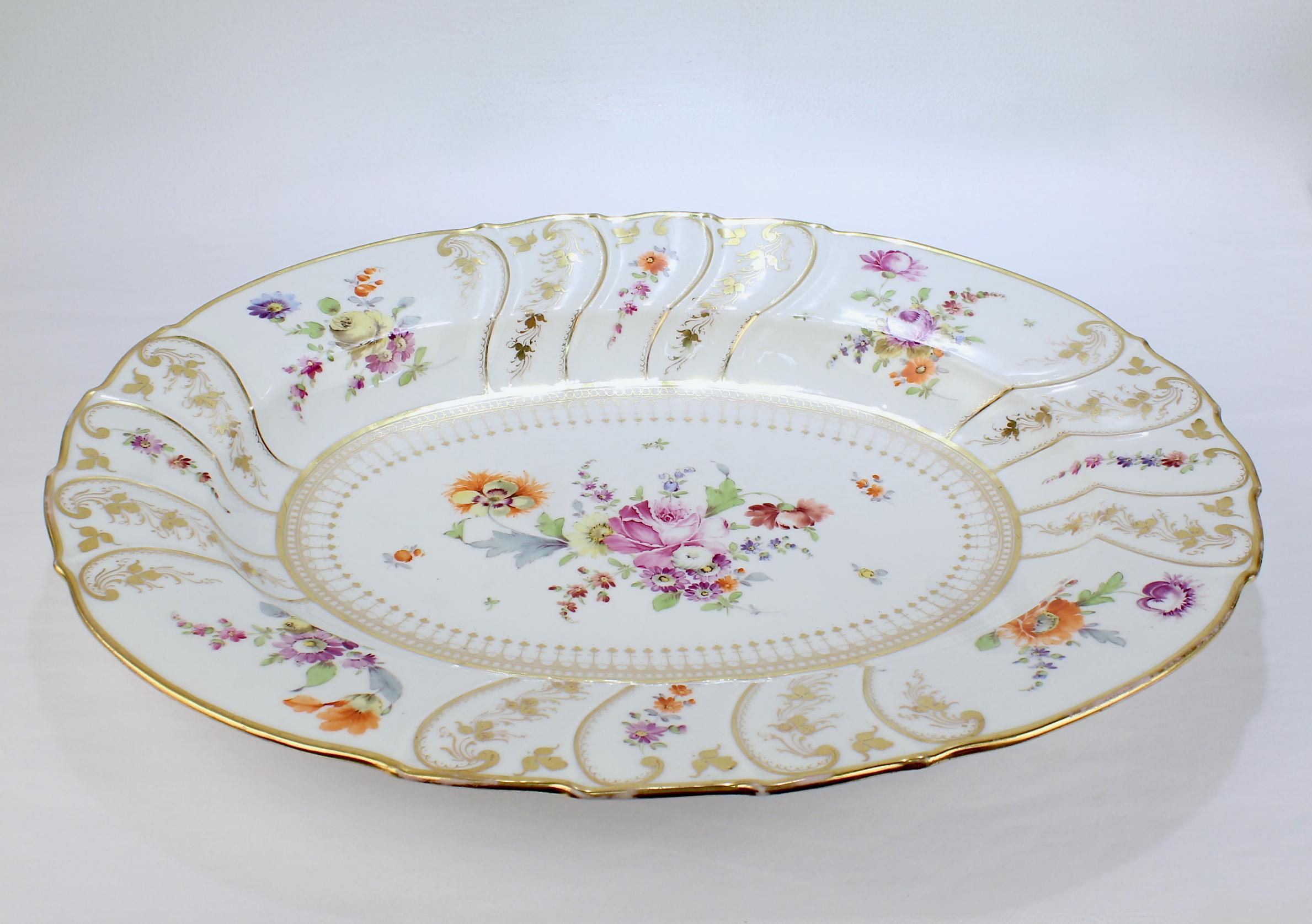A fine and large Dresden porcelain tray or platter by Richard Klemm. 

With a ribbed, scalloped border and deep central well.

Richly decorated with hand painted 'Deutsche Blumen' style flowers.

Simply a wonderful piece of porcelain!

Date: