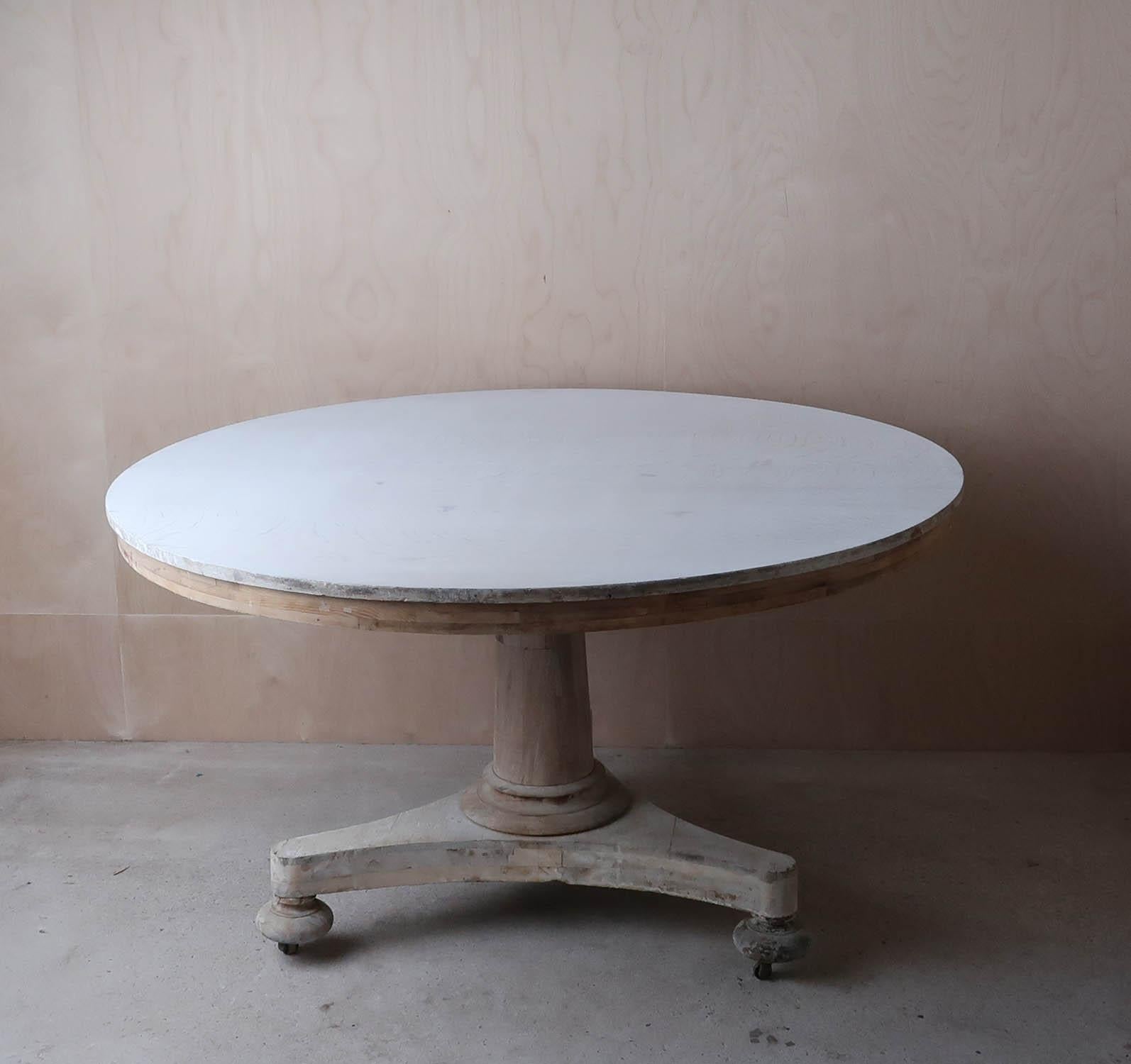 Fabulous large round Georgian table. 

Made from oak, pine and bleached tropical hardwood.

Beautifully figured top.

Great simple lines. 

I have chosen not to lacquer or wax the table.

2 original brass castors. 1 similar replaced