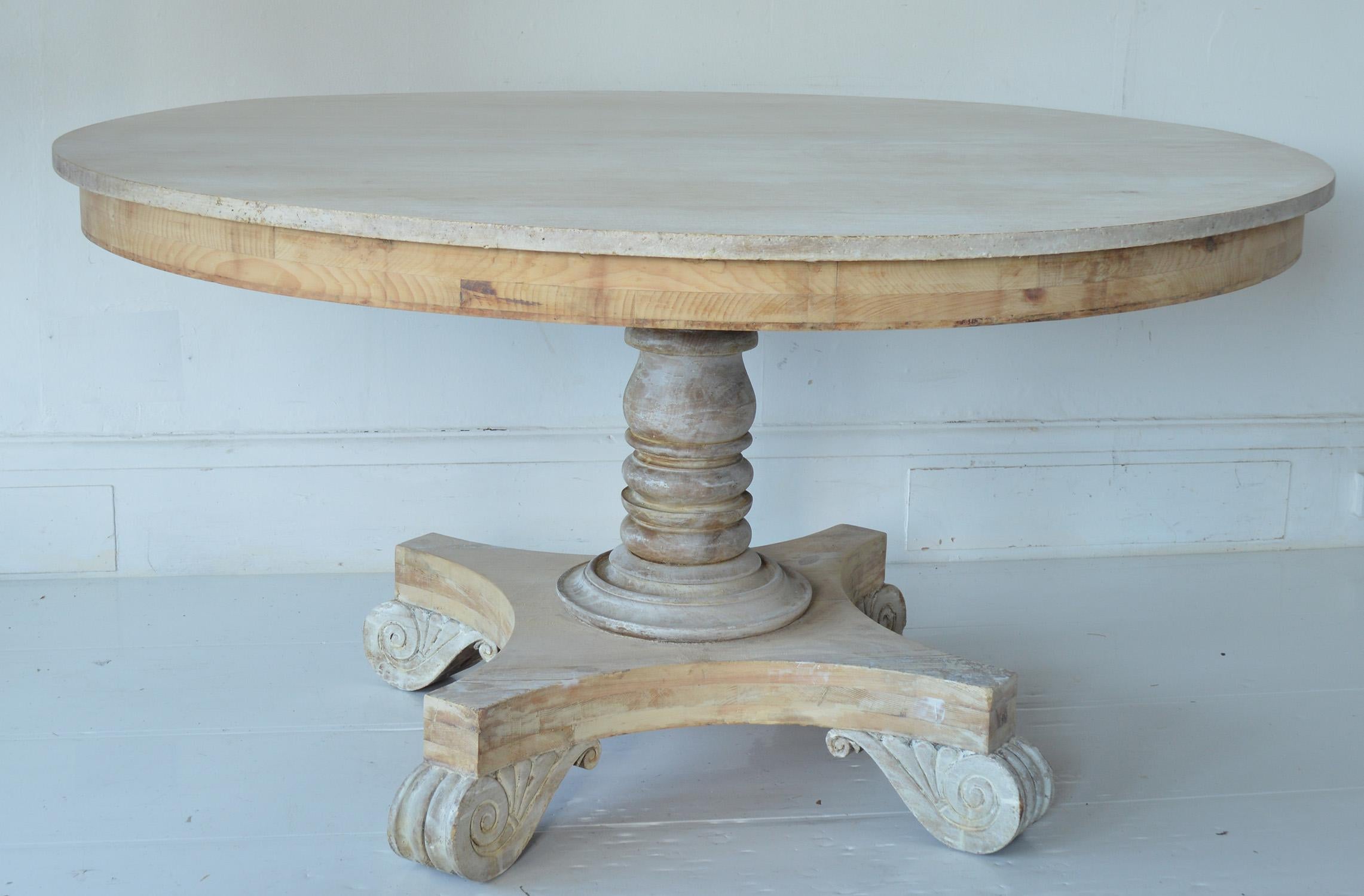 Fabulous large round table. Made from bleached pine and Honduras mahogany.

Original castors and hardware. The top does tip.

Great simple lines. I particularly like the carved anthemion details on the feet.

I have chosen not to lacquer or