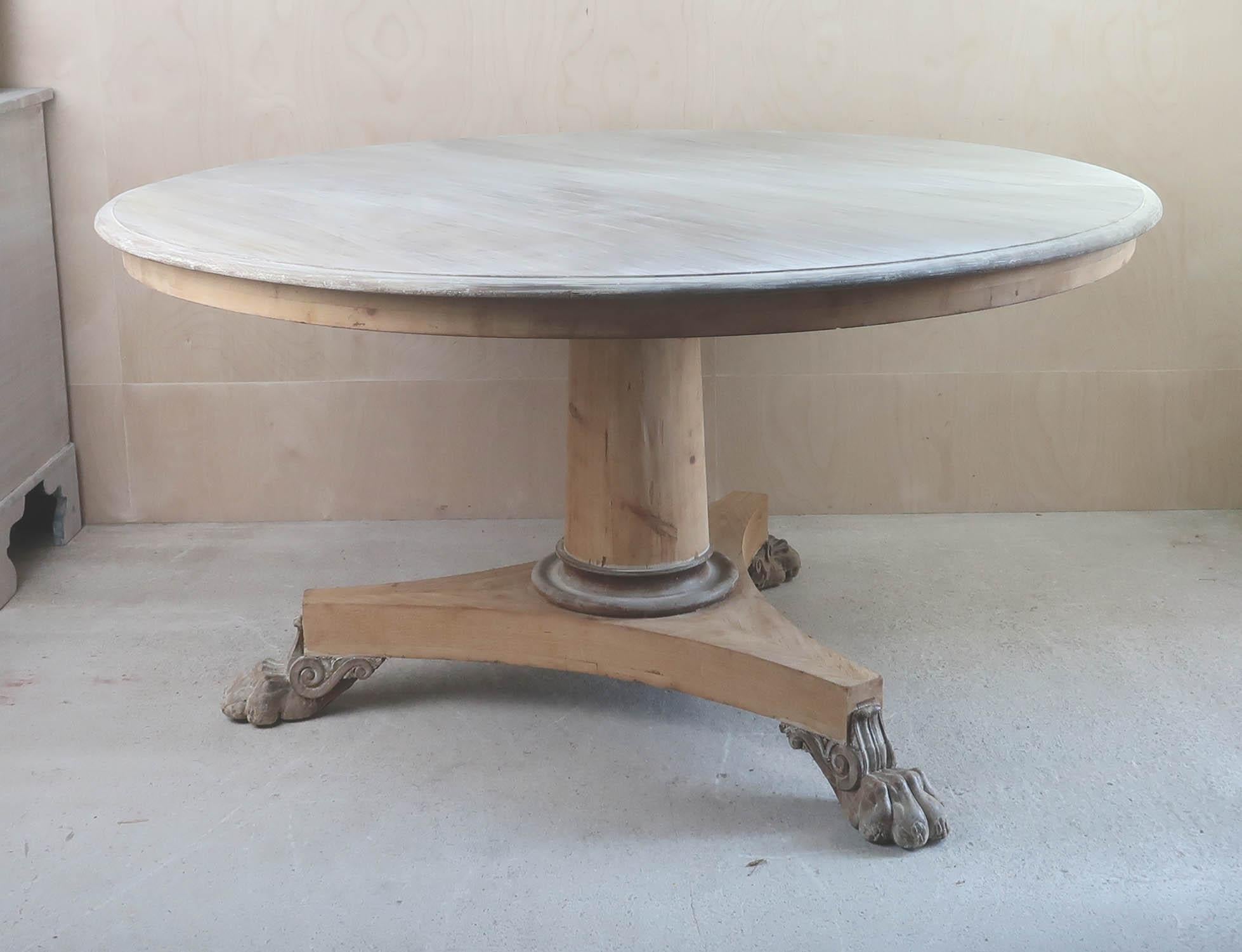 Fabulous large round Georgian table. 

Made from pine and bleached tropical hardwood.

Beautifully figured top. Carved lions paw feet.

Great simple lines. 

I have chosen not to lacquer or wax the table.

Original castors. Sturdy