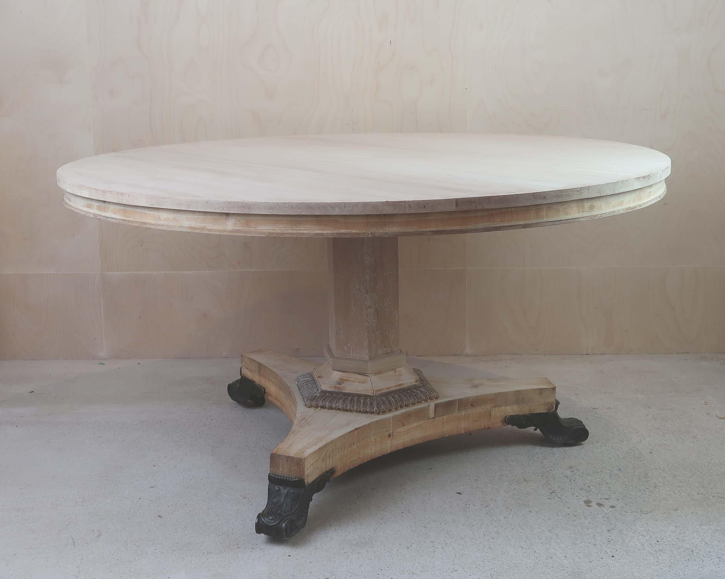 Fabulous large round Georgian table. 

Made from bleached topical hardwood, pine and oak

Great simple lines. 

Wonderful bronze feet

I have chosen not to lacquer or wax the table.

Original castors. Sturdy construction.

Free UK shipping





