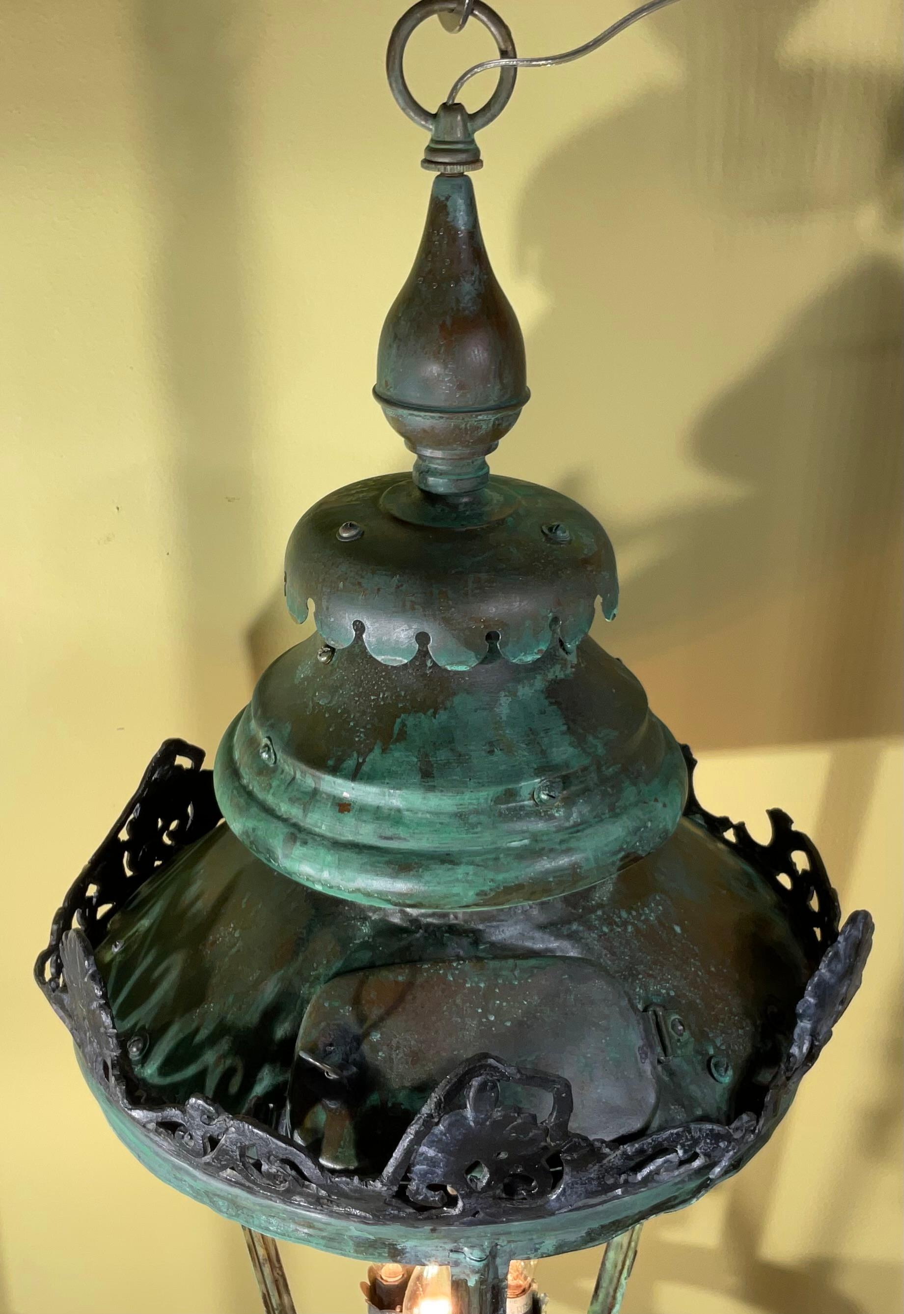 Beautiful handcrafted lantern made of copper with three 60/watt lights.
Electrified and ready to use , Beautiful oxidization patina.
This lantern was originally antique post gas lantern , you can see at the top the opening which they used to light