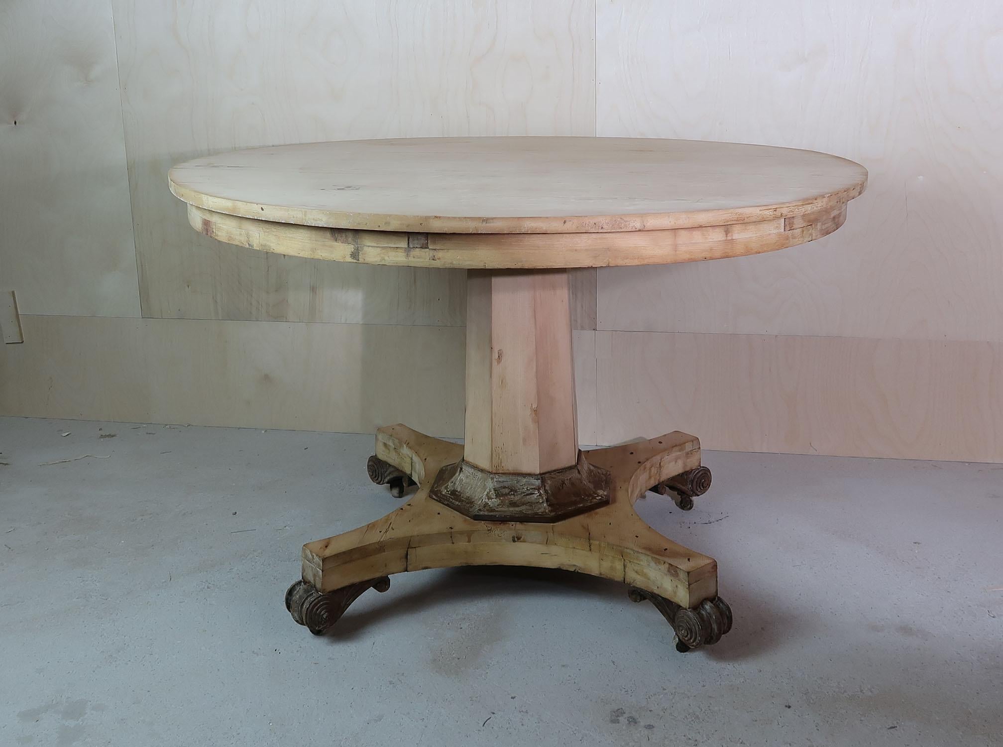 Fabulous large round Georgian table. Made from pine with bleached tropical hardwood detail to the base of the column support and feet.

Beautifully figured top.

Great simple lines. I particularly like the plain column and the anthemion shaped