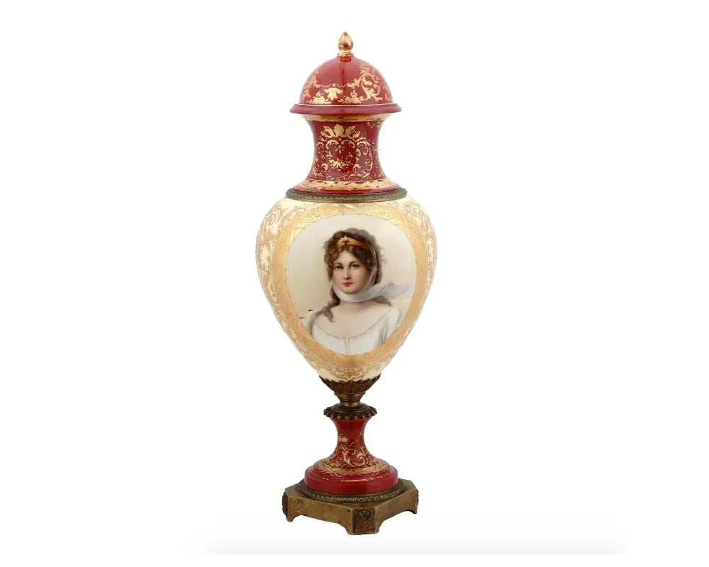 A large antique Royal Vienna covered bronze mounted and porcelain urn vase. The vase is adorned with hand painted double portrait of ladies and covered with raised gilded highlights. Signed by the artist, Karl. Circa: late 19th century. Mounted on a