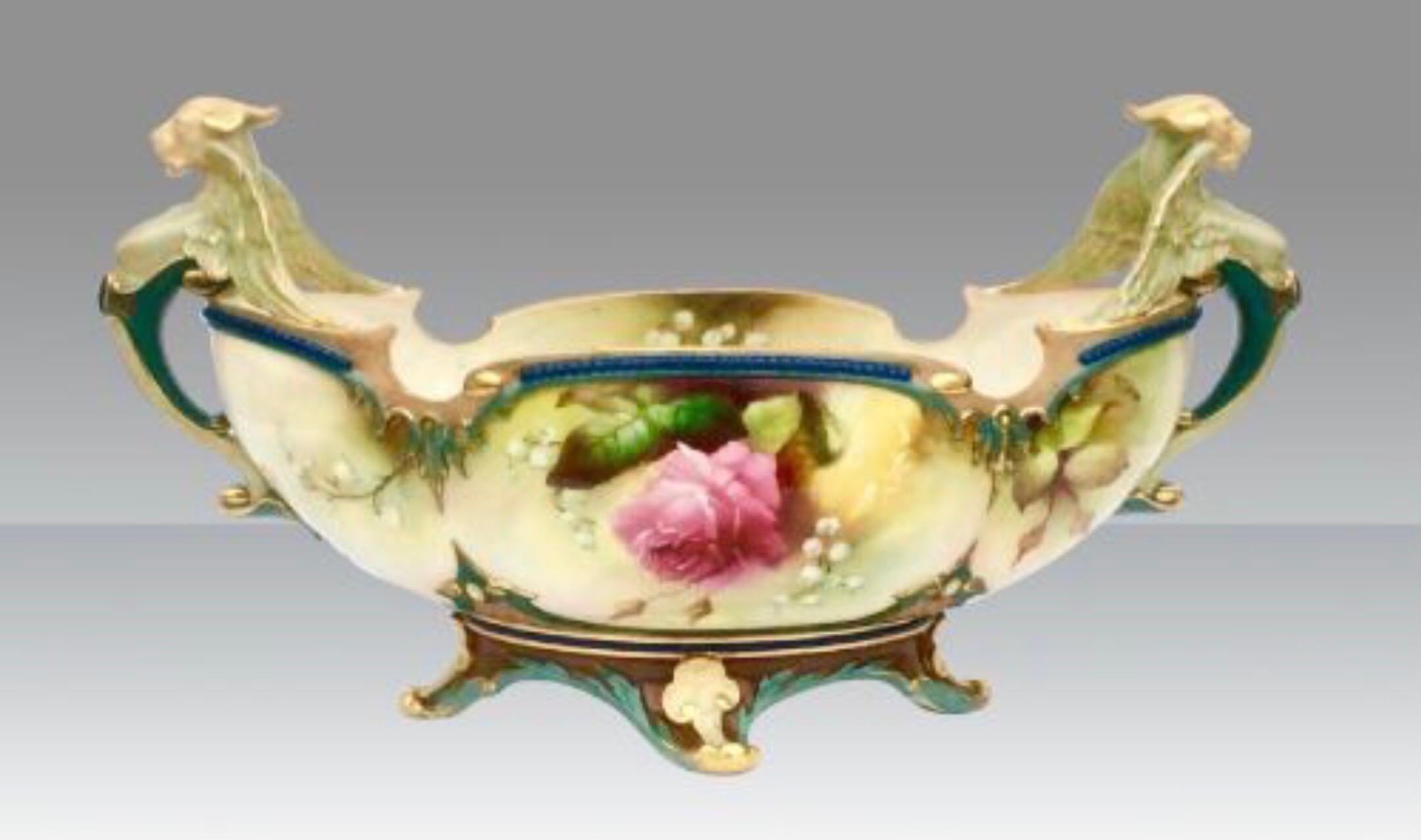 Magnificent large antique Hadley Royal Worcester boat shaped centrepiece vase with anthropomorphic handles beautifully hand painted with roses and butterflies,superbly gilted and signed By W Lewis,
Measures: 14ins x 7.5ins x 6ins deep
Dated 1907.