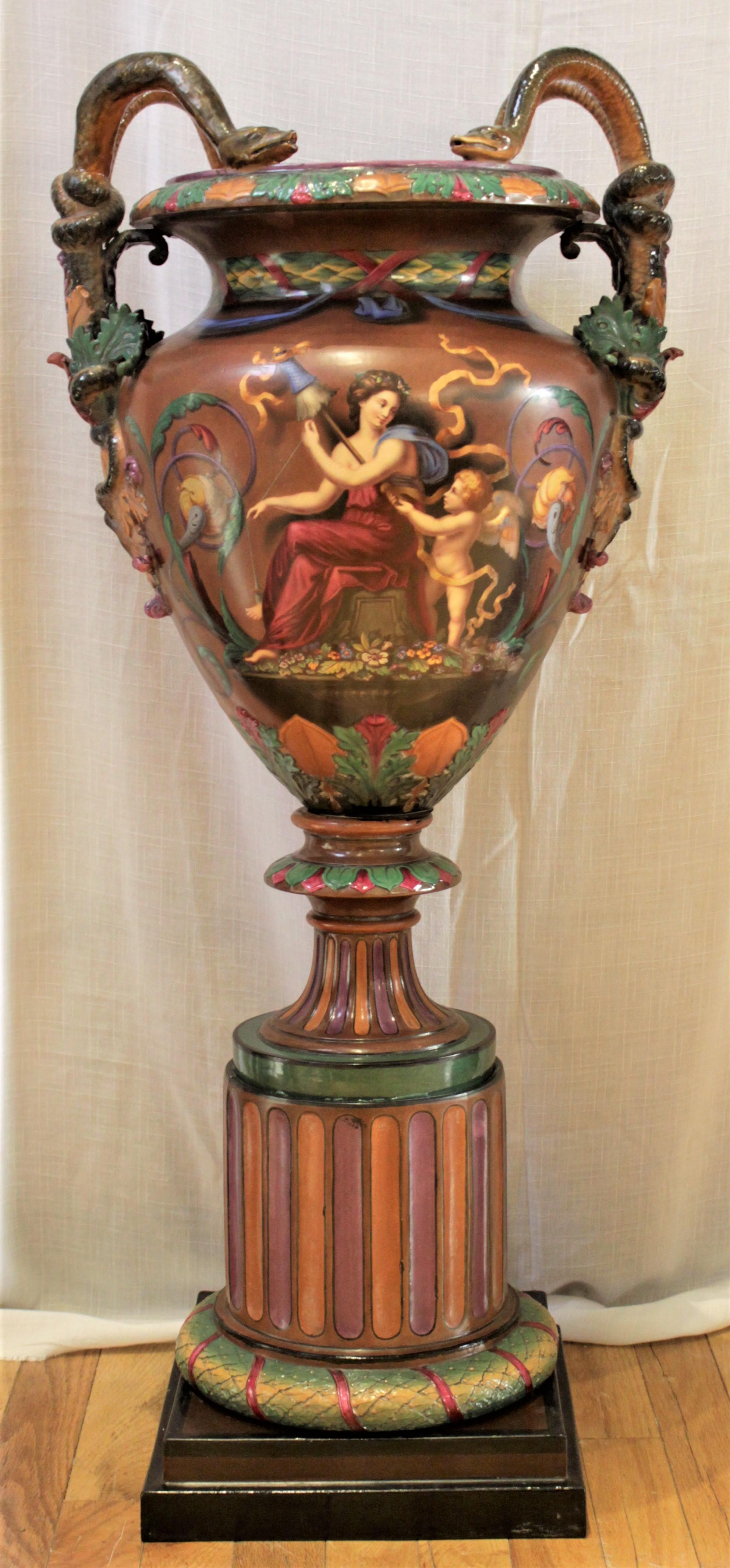 This large and impressive antique majolica Exhibition vase or urn was made by the Royal Worcester factory in approximately 1864 in the Baroque Revival style. This piece is clearly stamped with the Royal Worcester crown mark in triplicate on the