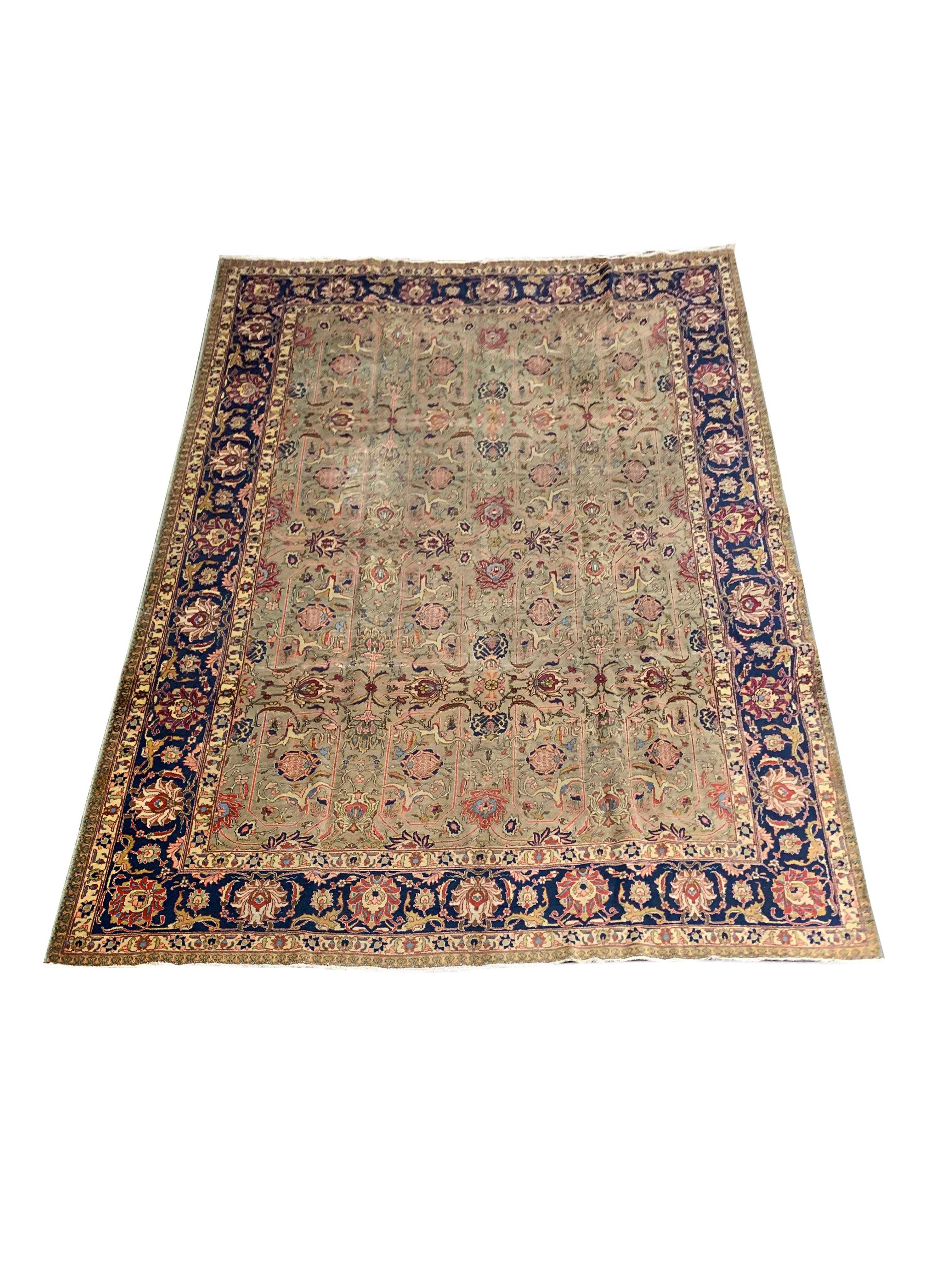 This striking area rug is a vintage handwoven wool area rug. The design features a green background colour with accents of red, pink, brown and beige that make up the intricate, Antique Rug with a decorative all over symmetrical design. A repeating