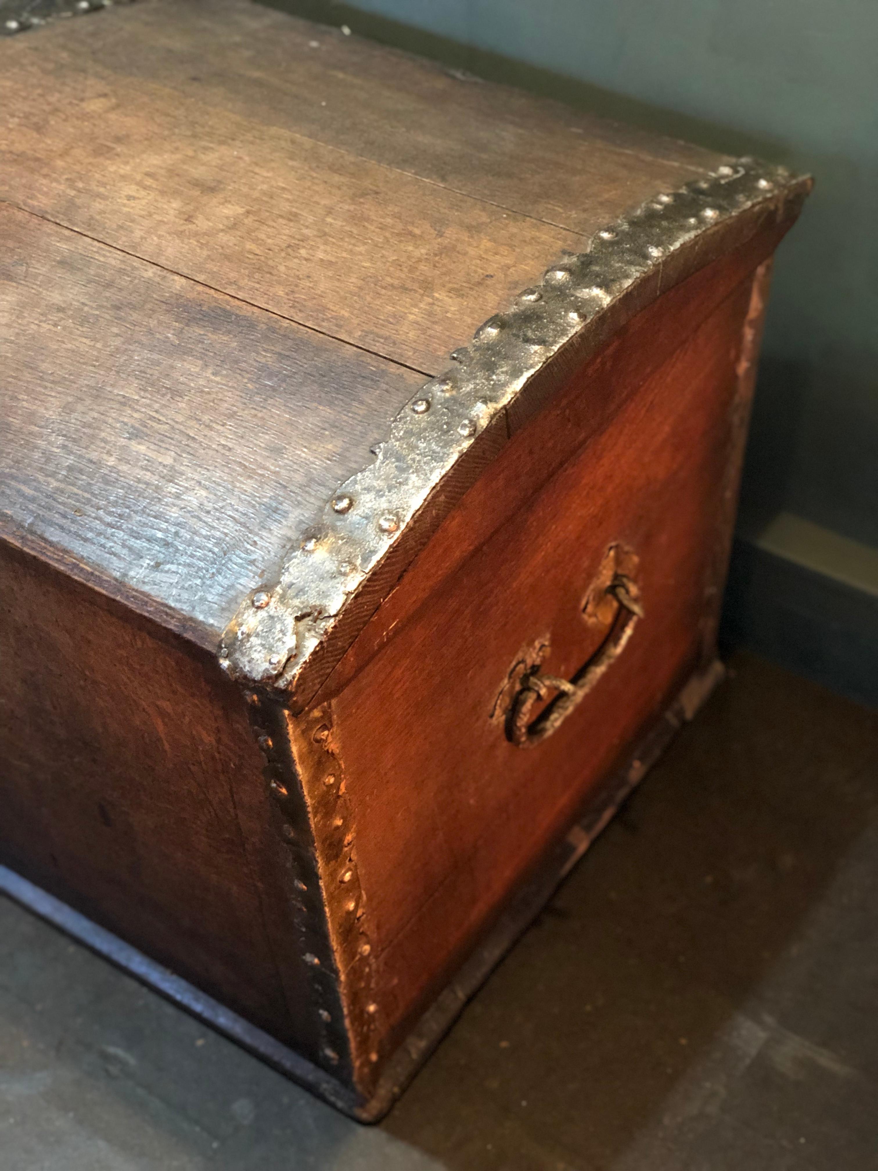 A very large antique Scandinavian oak trunk dating from very late 18th-early 19th century. Solid European white oak construction with handmade metal straps and lock with original key. Heavy forged iron carry handles to each end. Clean interior.
 