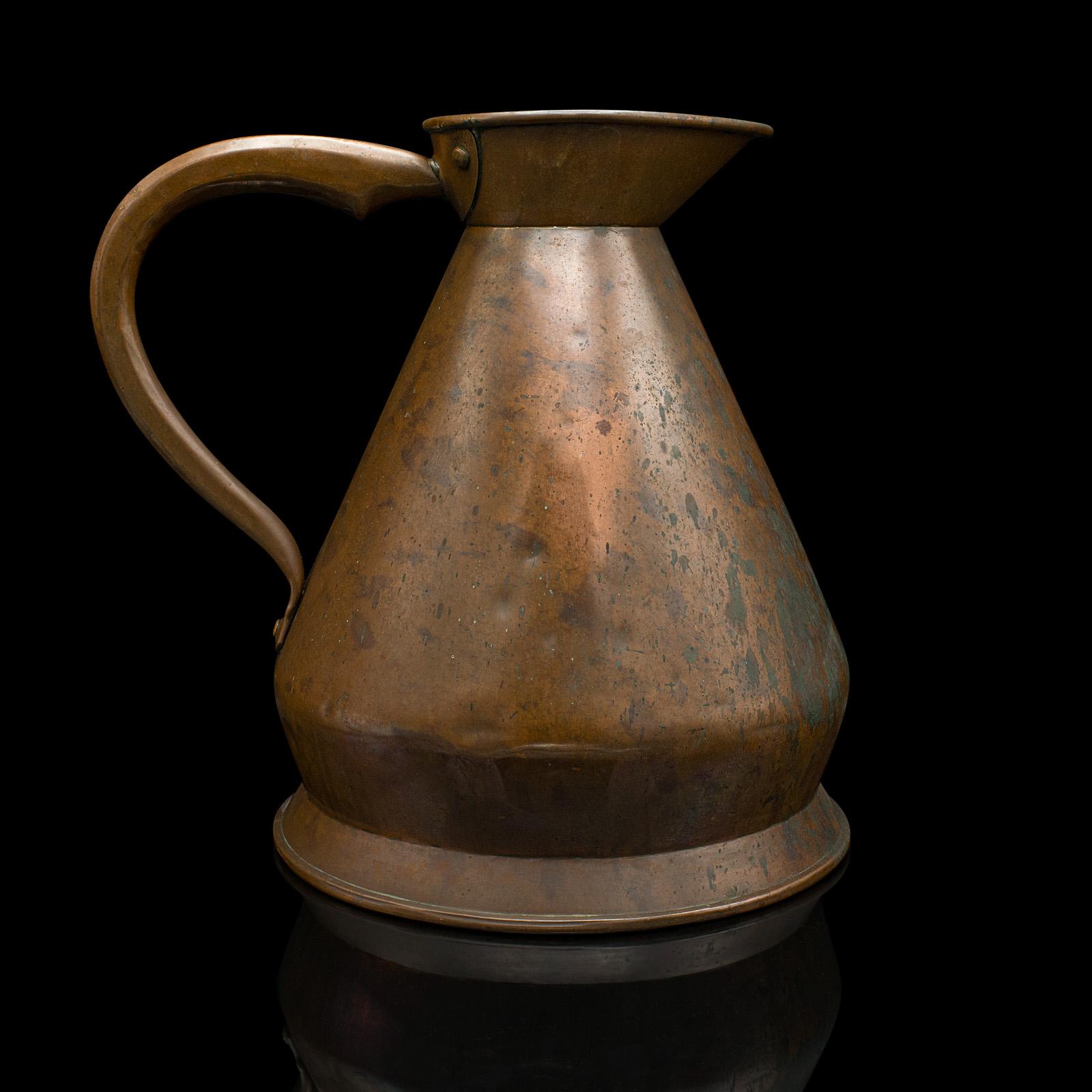 This is a large antique serving jug. An English, copper 2 gallon ewer, dating to the Victorian period, circa 1880.

Fascinatingly sized jug with a wonderful weathered appearance
Displays a desirable aged patina and in good original order
Copper