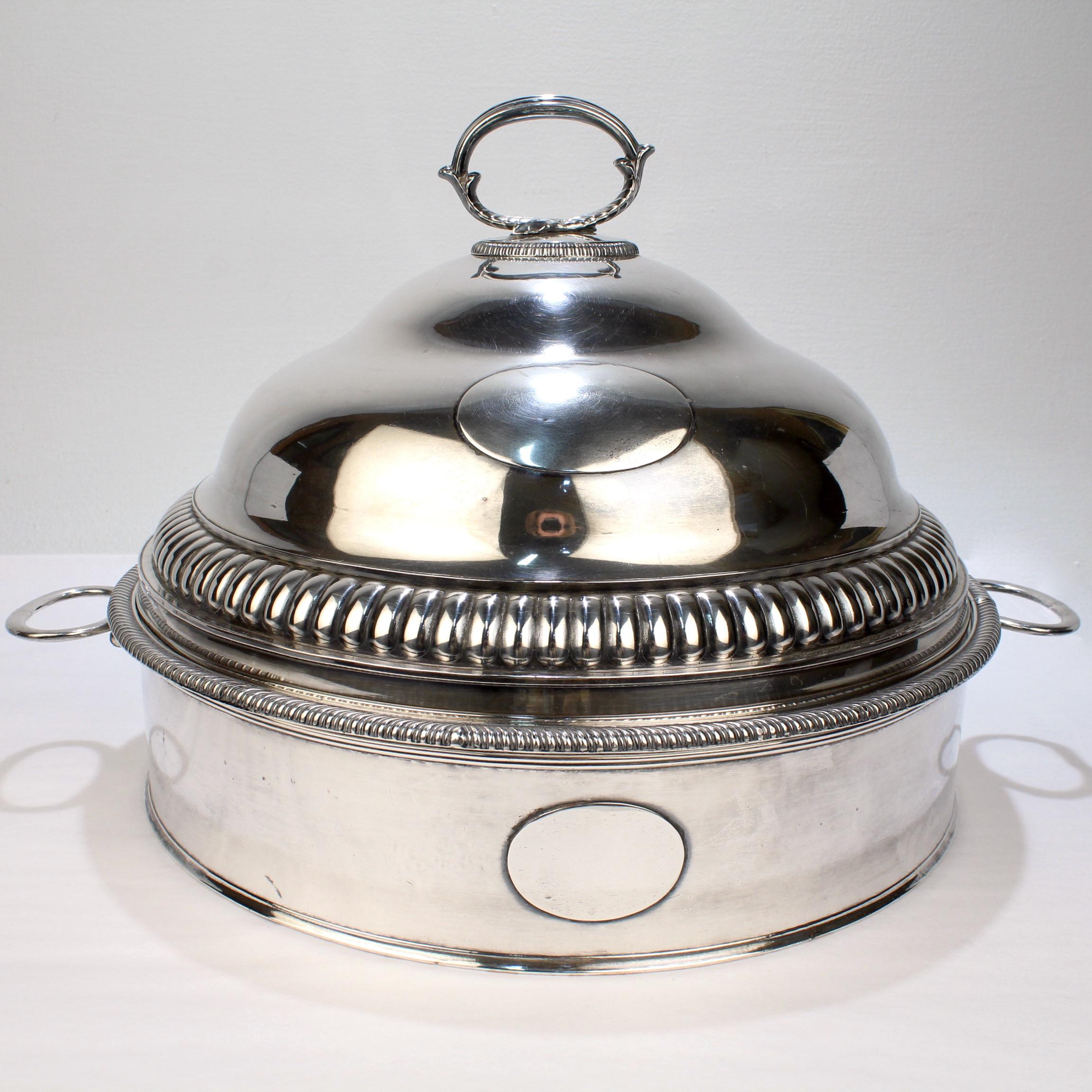 A very fine antique Sheffield silver plate service piece.

A rare and complex serving vessel comprising a handled base with removable liner that allows for warming (or cooling), a 4-section removable divider, and a hand hammered round dome or cover.