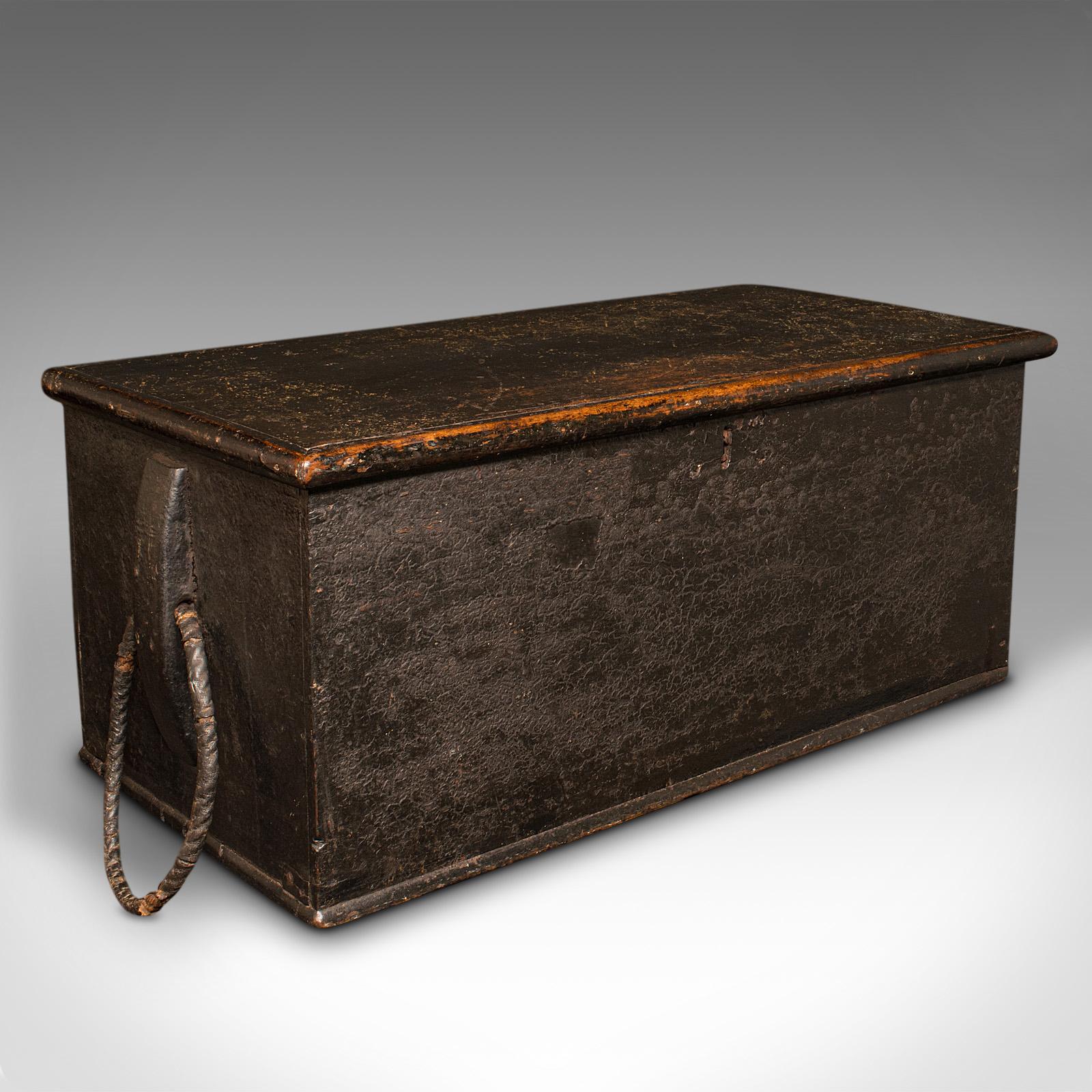 This is a large antique ship's chest. An English, ebonised pine shipping or workman's trunk, dating to the early Victorian period, circa 1850.

Of impressive proportion, a delightfully weathered shipping chest
Displays a desirable aged patina and