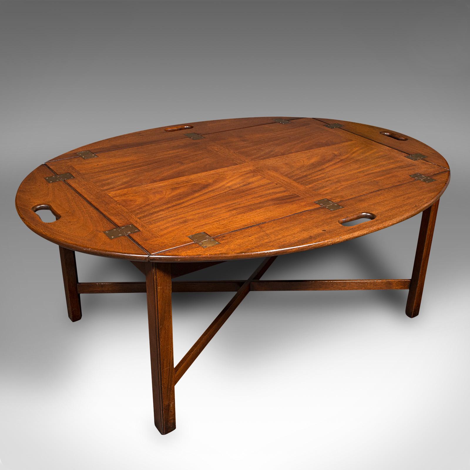 This is an antique ship's serving table. An English, mahogany butler's stand with galley sides, dating to the Edwardian period, circa 1910.

Of superb proportion with beautiful figuring
Displays a desirable aged patina and in good order
Select
