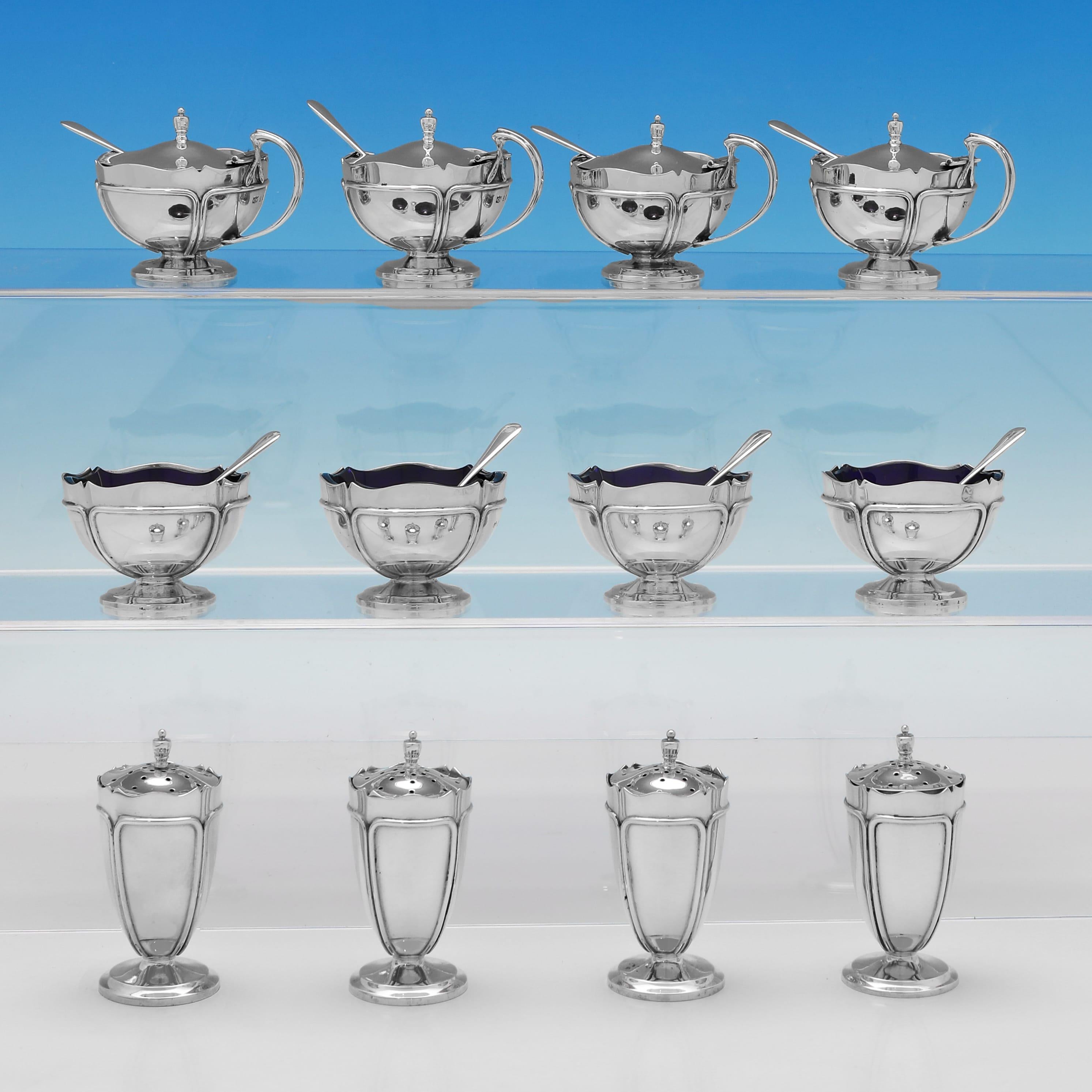 Hallmarked in Birmingham in 1924 by Mappin & Webb, this attractive, Antique, George V period, Sterling Silver Condiment Set, comprises 4 mustard pots with mustard spoons, 4 pepper pots and 4 salt cellars with salt spoons, all in the art nouveau
