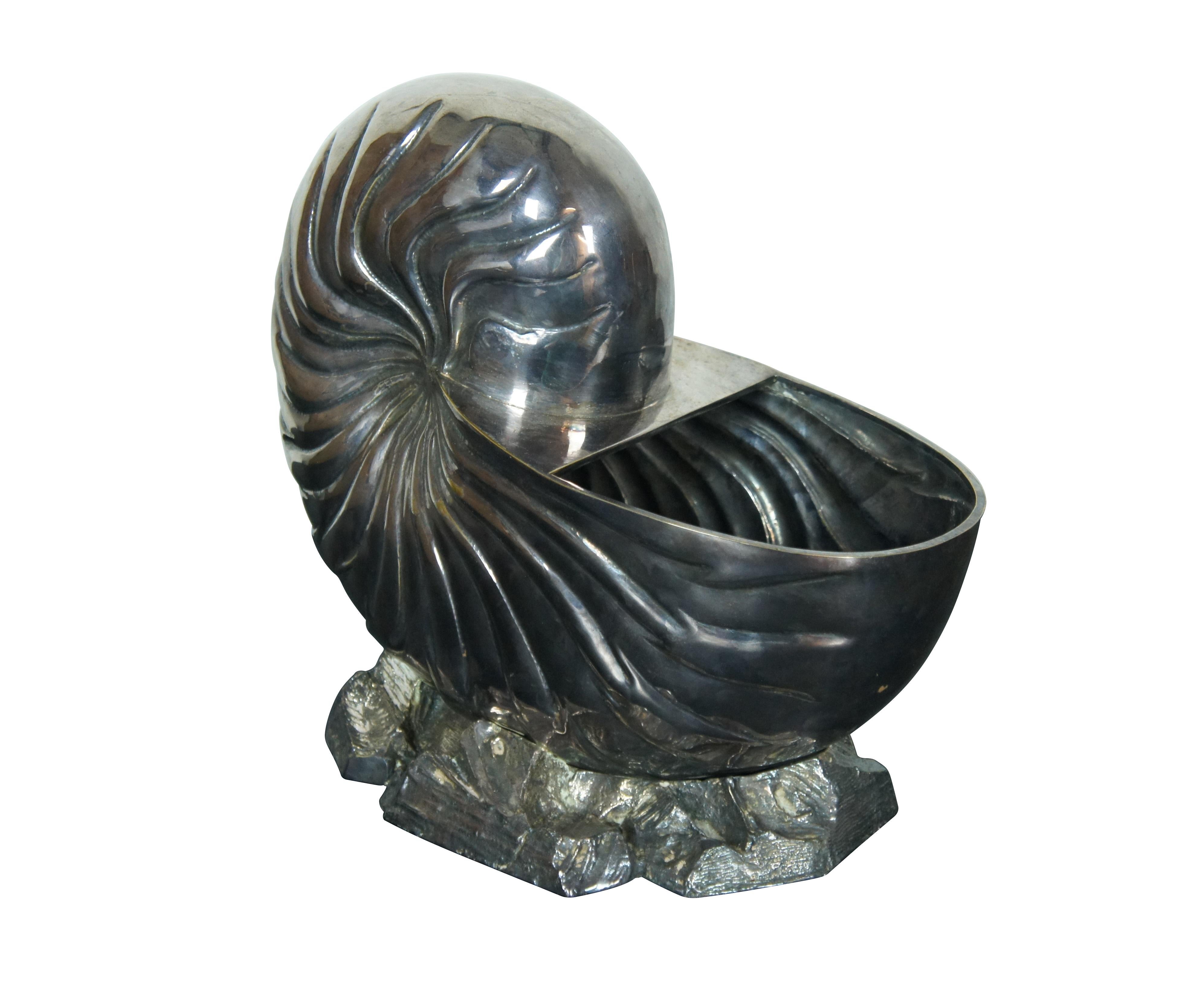 Very large early 20th century silverplated spoon warmer / centerpiece vase / cachepot in the shape of a nautilus / spiral sea shell on rocks. This design has a partial lip at the opening but no lid.

Dimensions:
12.5