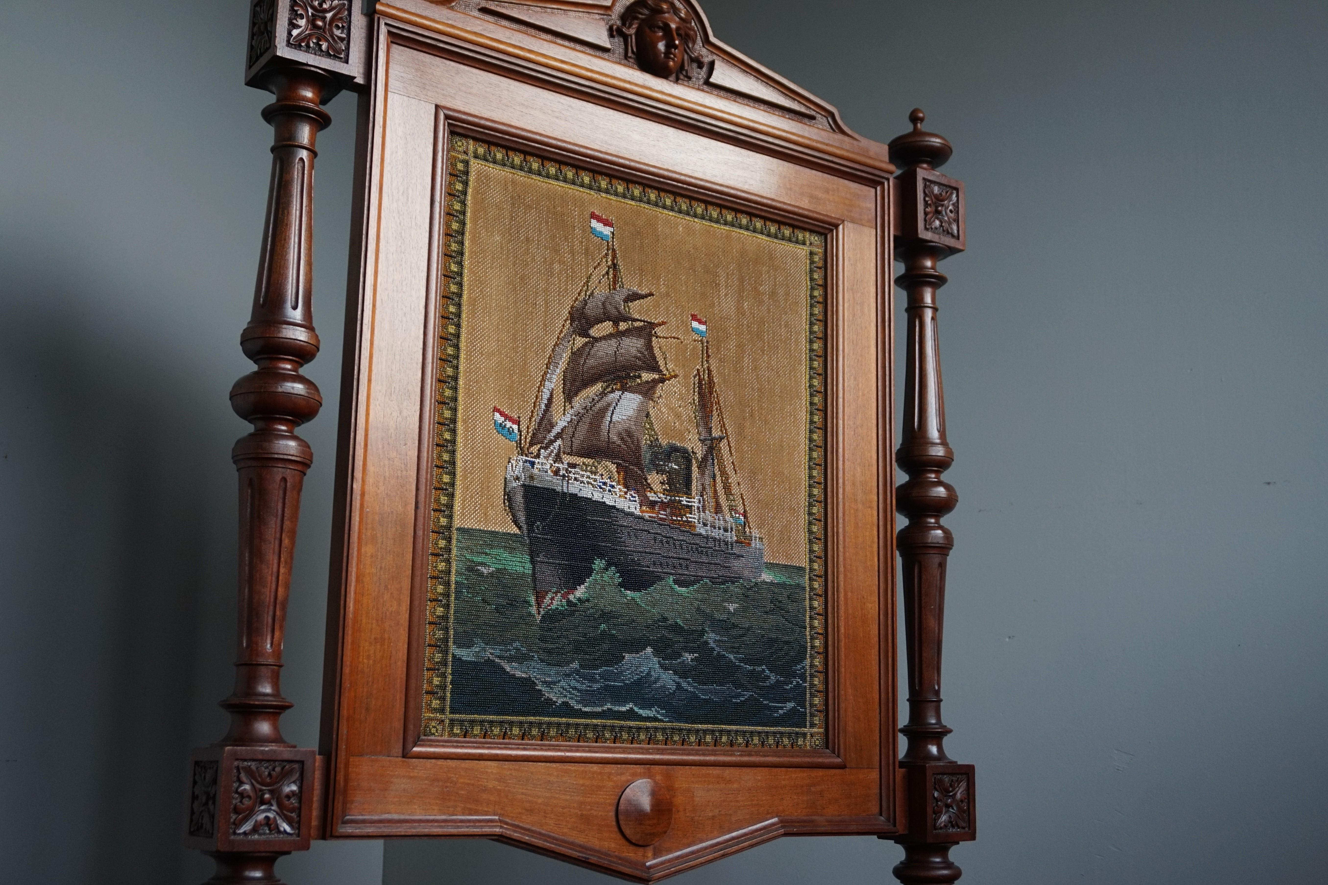 Stunning antique work-of-art-firscreen with a sculpture of Amphitrite on top.

This all handcrafted firescreen from the mid-late 1800s definitely is a one of a kind antique. Back in the day it would have been made to stand in front of the fireplace