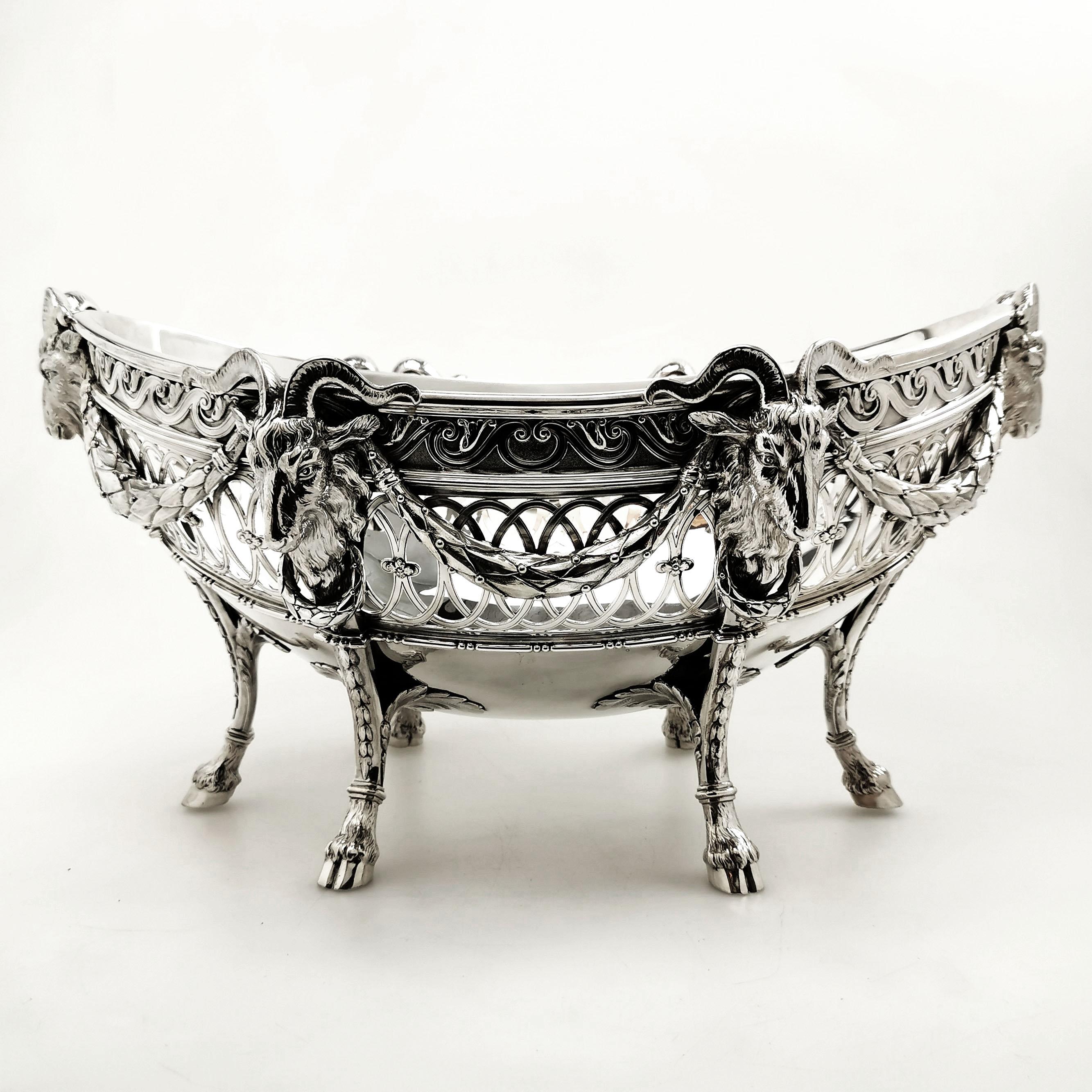 A magnificent exceptionally heavy Antique Silver Bowl, standing on six hoofed topped with impressive rams heads. This Oval Dish has a pierced pattern around the sides. This Bowl is of substantial size, but of notably heavy weight.

Made in London in