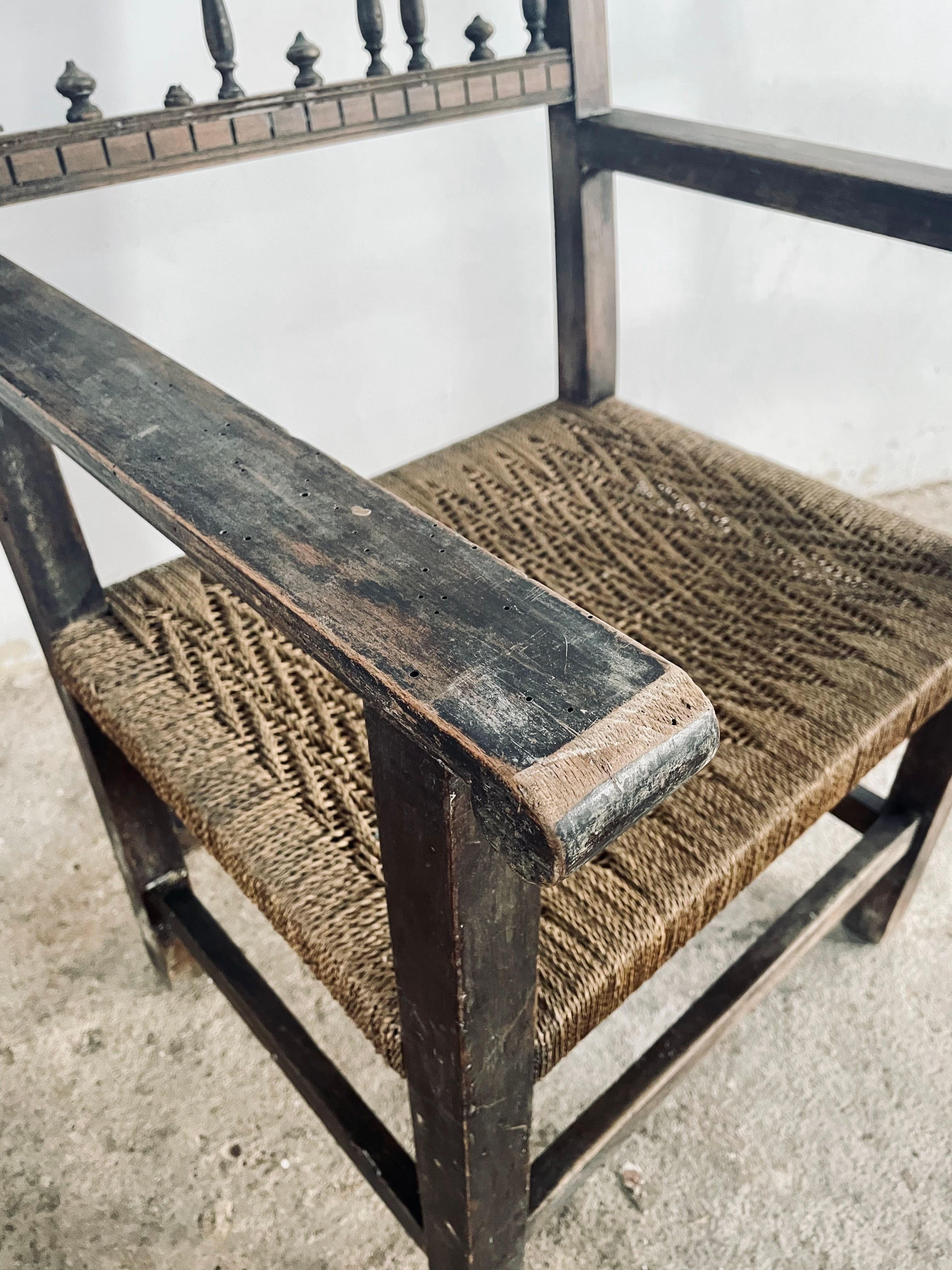 Large Antique Solid Wood and Rope Woven Seat Armchair, Rare Spanish Wooden Casti In Fair Condition For Sale In PEGO, ES