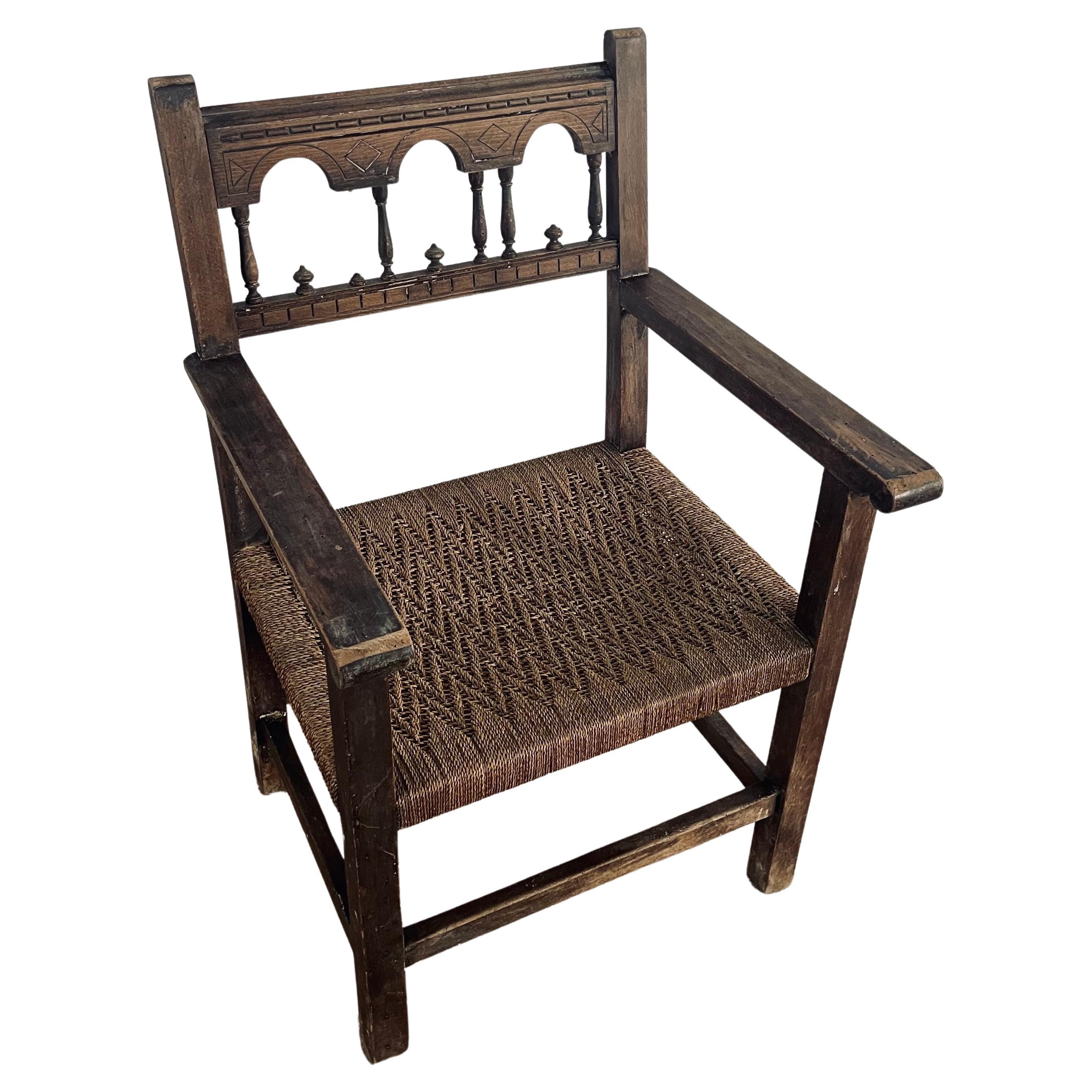 Large Antique Solid Wood and Rope Woven Seat Armchair, Rare Spanish Wooden Casti For Sale