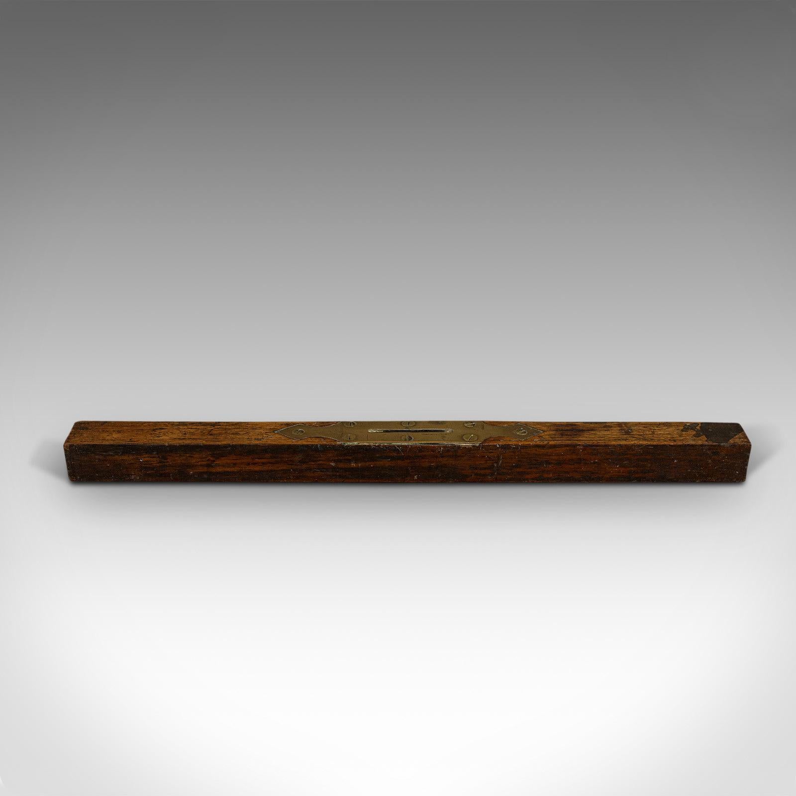 This is a large antique spirit level. An English, mahogany and brass craftsman's instrument, dating to the William IV period, circa 1830.

Charming, early 19th century instrument
Displays a desirable aged patina
Mahogany body shows Fine grain