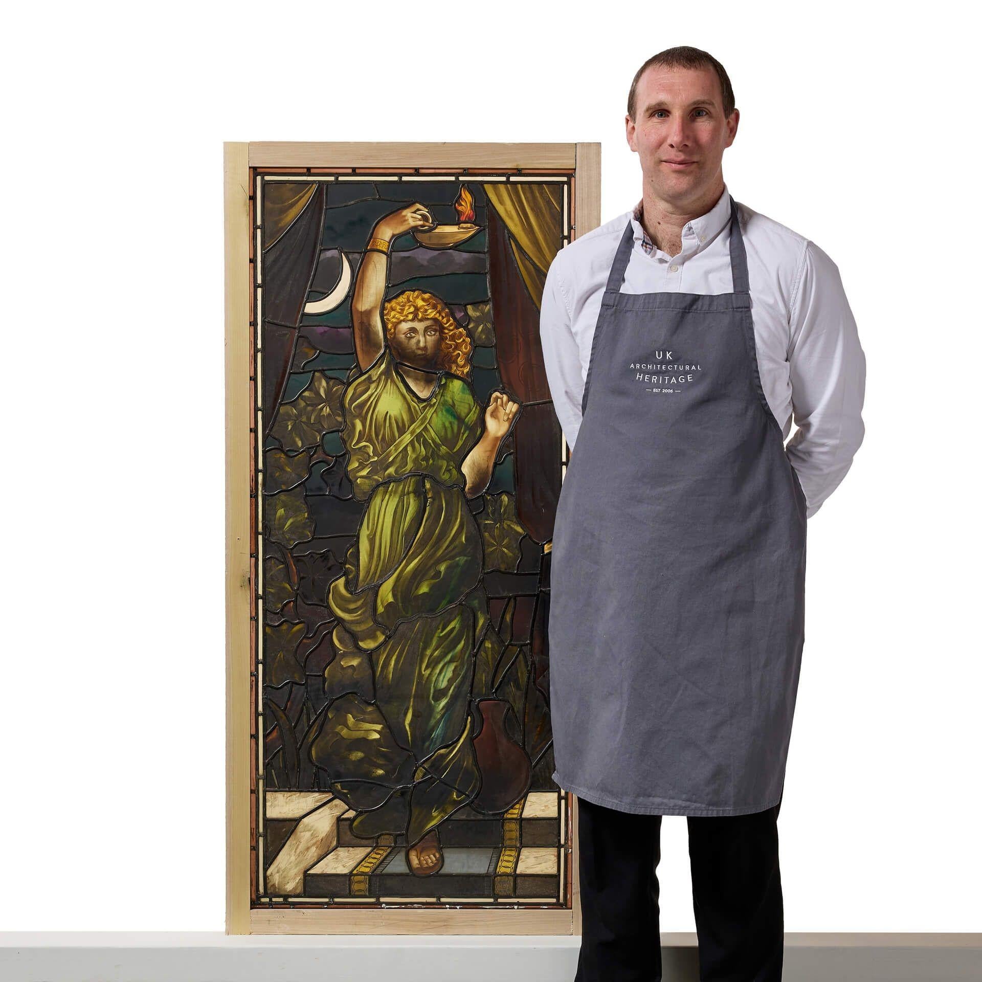 A large antique late 19th century stained glass panel depicting an allegorical classical maiden, thought to be the goddess Nyx, in the manner of Stephen Adam & Son, Glasgow.

The panel depicts the figure clad in a diaphanous robe with long curling