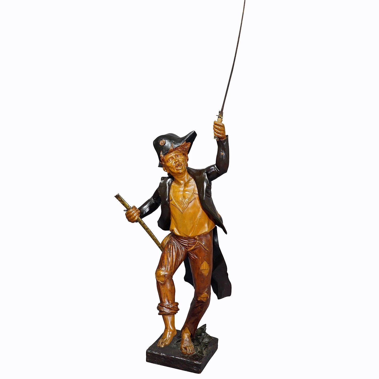 Large Antique Statue of a French Freedom Fighter ca. 1920s

A large wooden French freedom fighter statue holding a metal saber. The hand-made sculpture was handcarved most probably in France around 1920. Height figure without saber: 56.3' inches