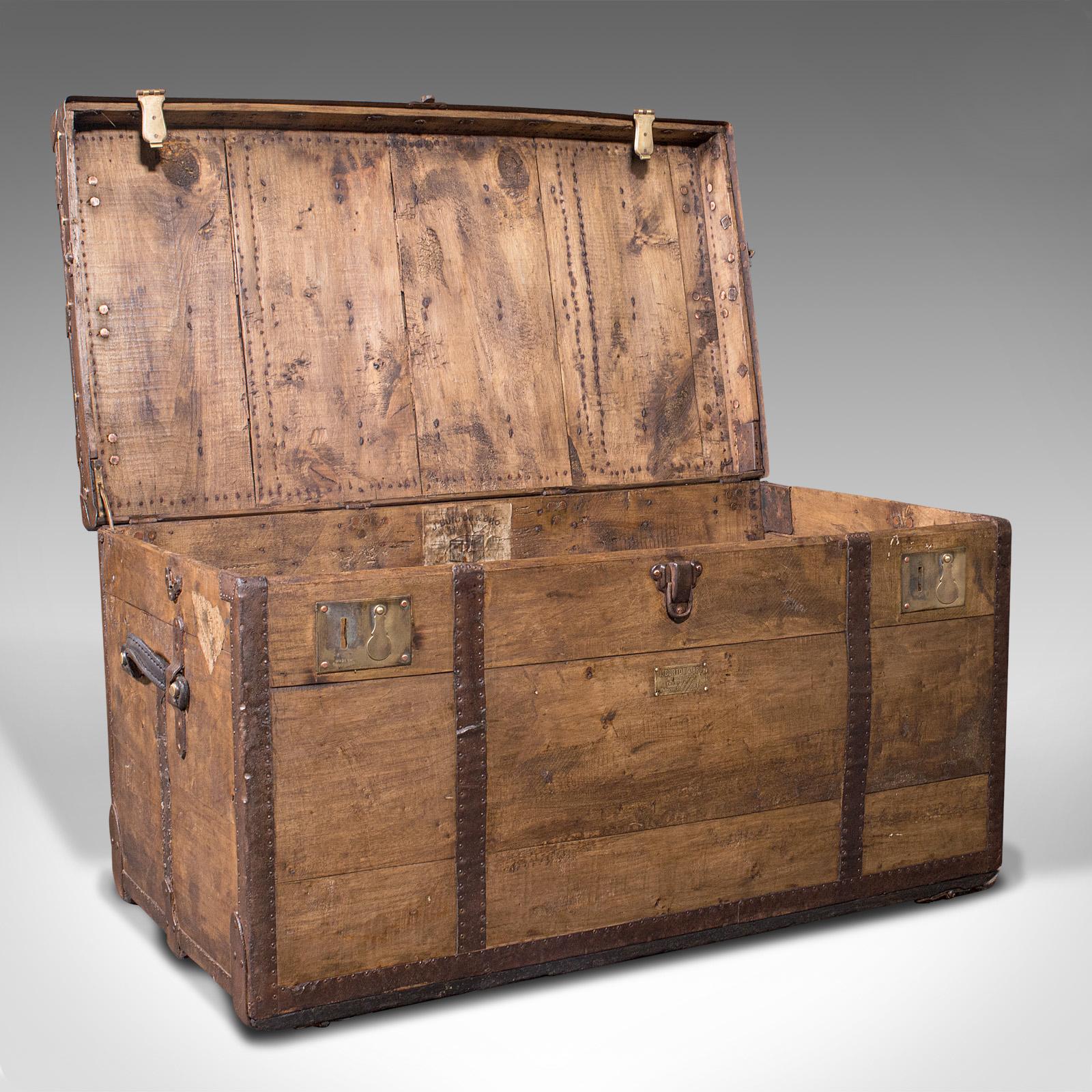 This is a large antique steamer trunk. An English, pine and iron travel or shipping chest, dating to the Victorian period, circa 1900.

Stout of build and antique visual appeal
Displays a desirable aged patina and in good order
Pine stocks show