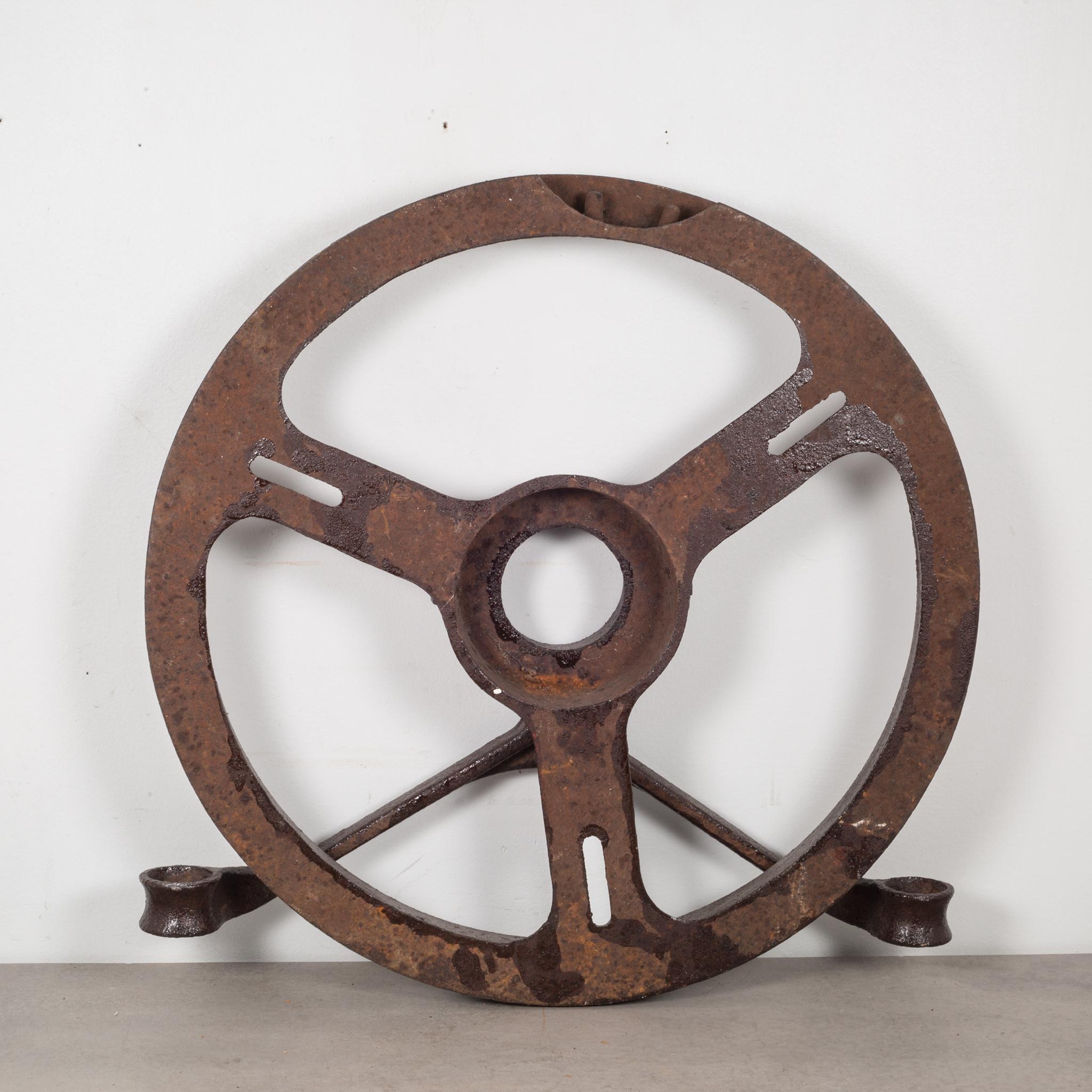 About

A large steel sprocket with a swinging arm in front. Embossed on the front 