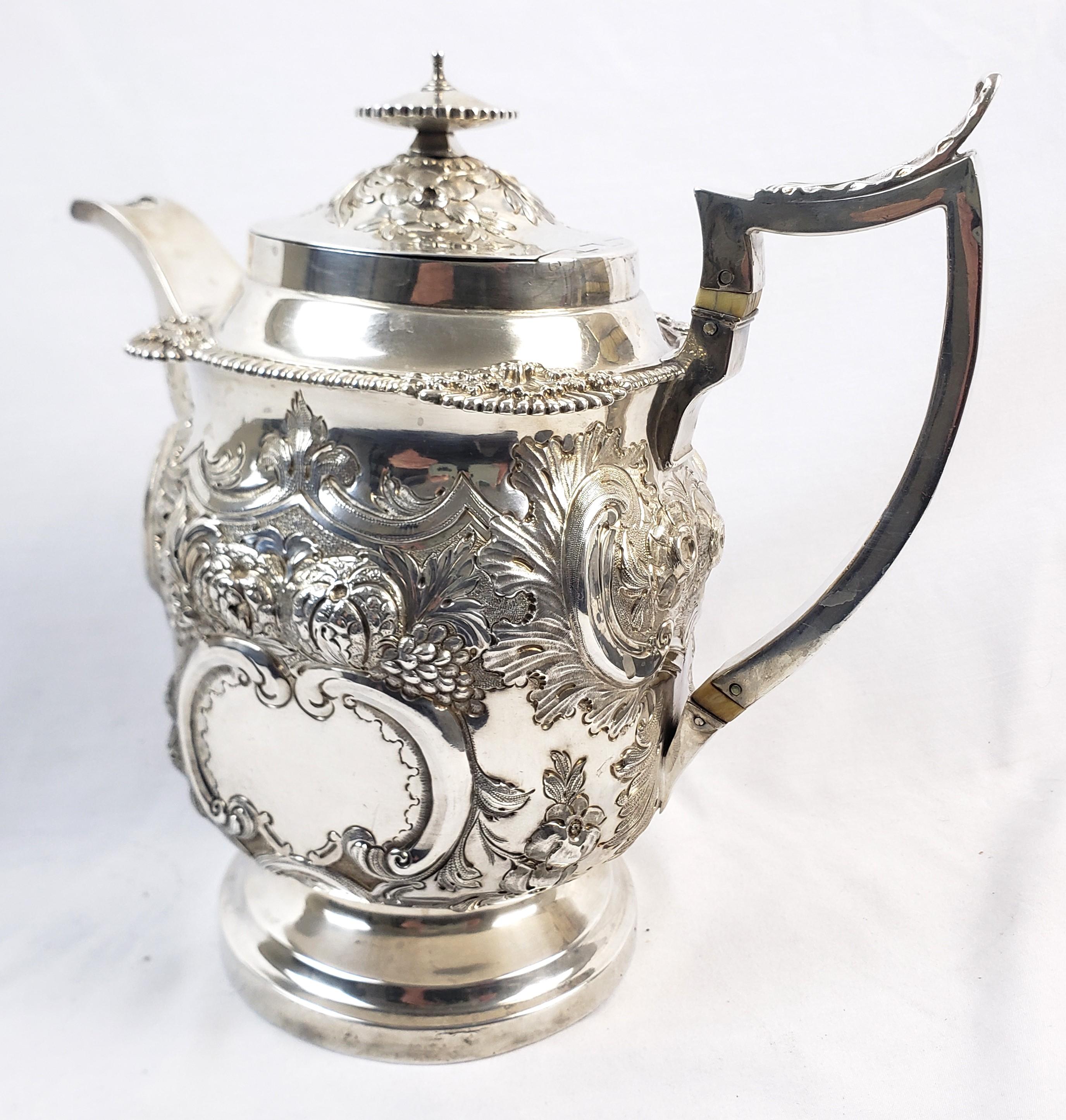 George IV Large Antique Sterling Silver Georgian Teapot with Ornate Repousse Decoration For Sale